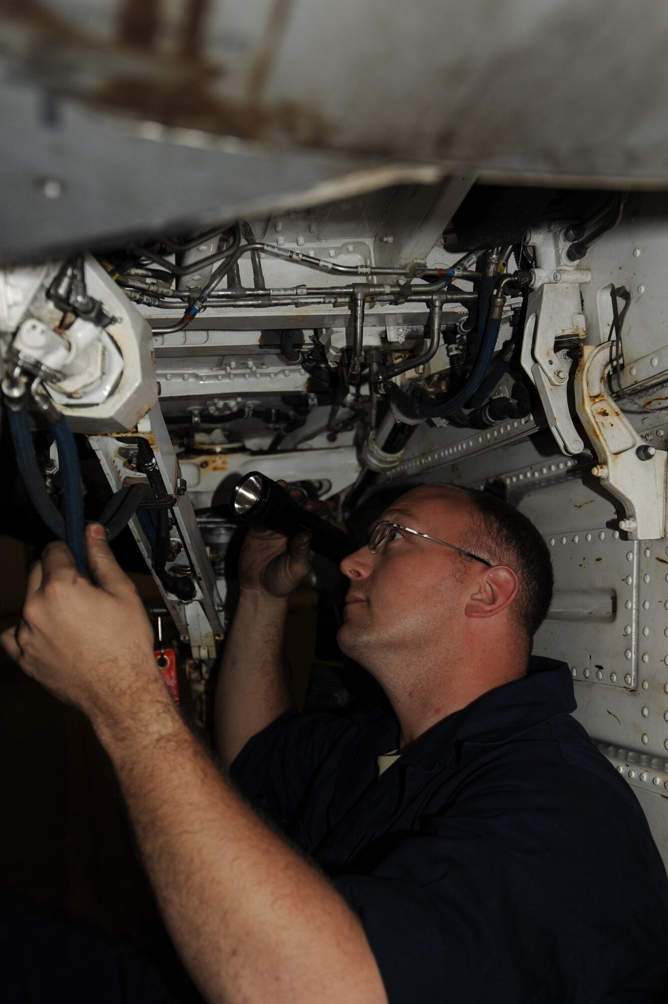 MISAWA AIR BASE, Japan -- Staff Sgt. Jack Williams, 35th Maintenance Squadron, 13th Aircraft Maintenance Unit crew chief, inspects an F-16 Fighting Falcon one final time before flight June 15.  Crew chiefs are responsible for all maintenance on the jet, ensuring it is operationally ready for flight. (U.S. Air Force photo/Staff Sgt. April Quintanilla)