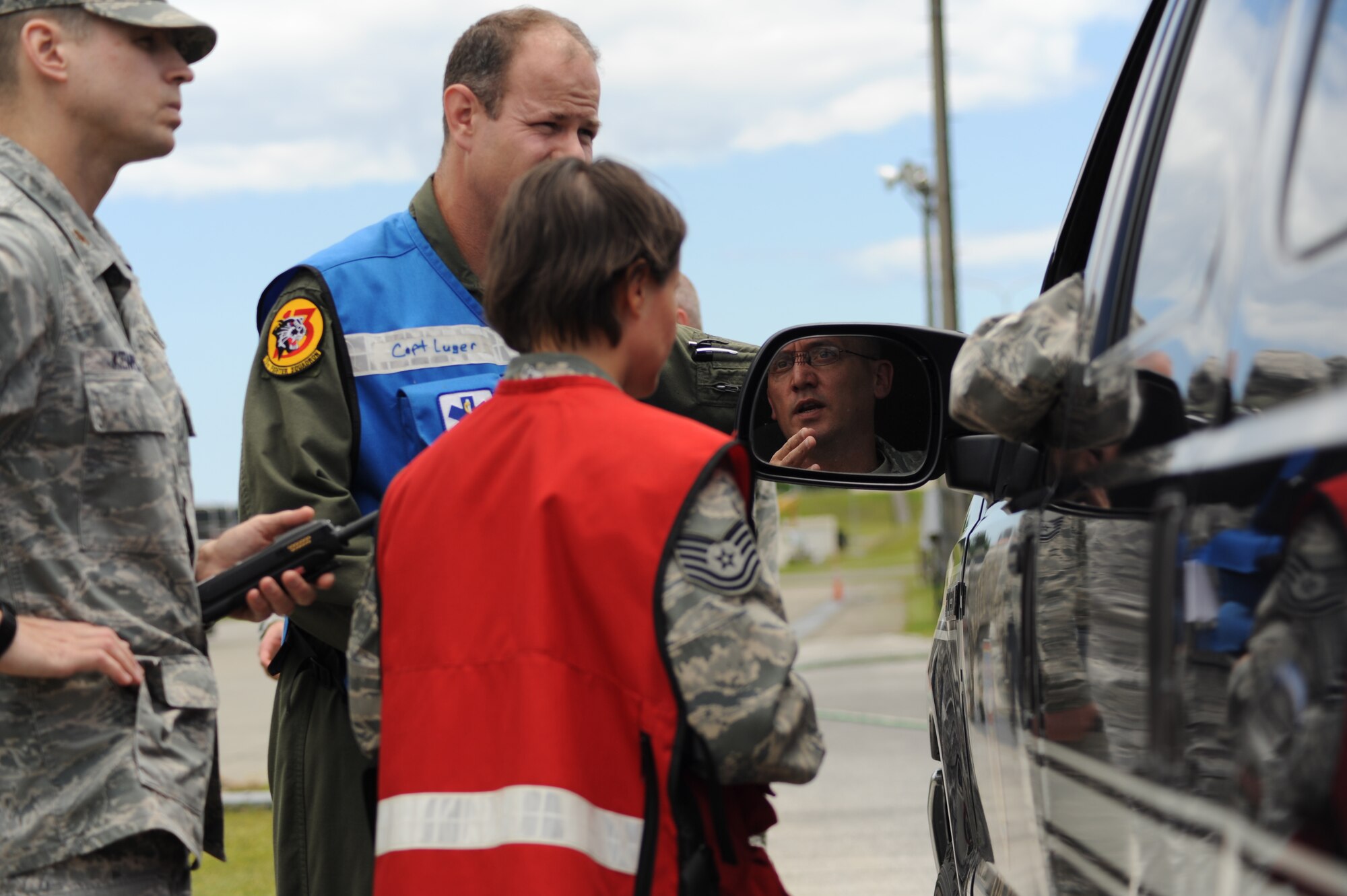 MISAWA AIR BASE, Japan – The emergency response medical team receives a situation brief from Master Sgt. Randall Swisher, 35th Civil Engineer Squadron fire department superintendent, during a training exercise June 15.  Routine training exercises allow different agencies to practice and refine coordinated responses to various scenarios.   (U.S. Air Force photo/Staff Sgt. April Quintanilla)
