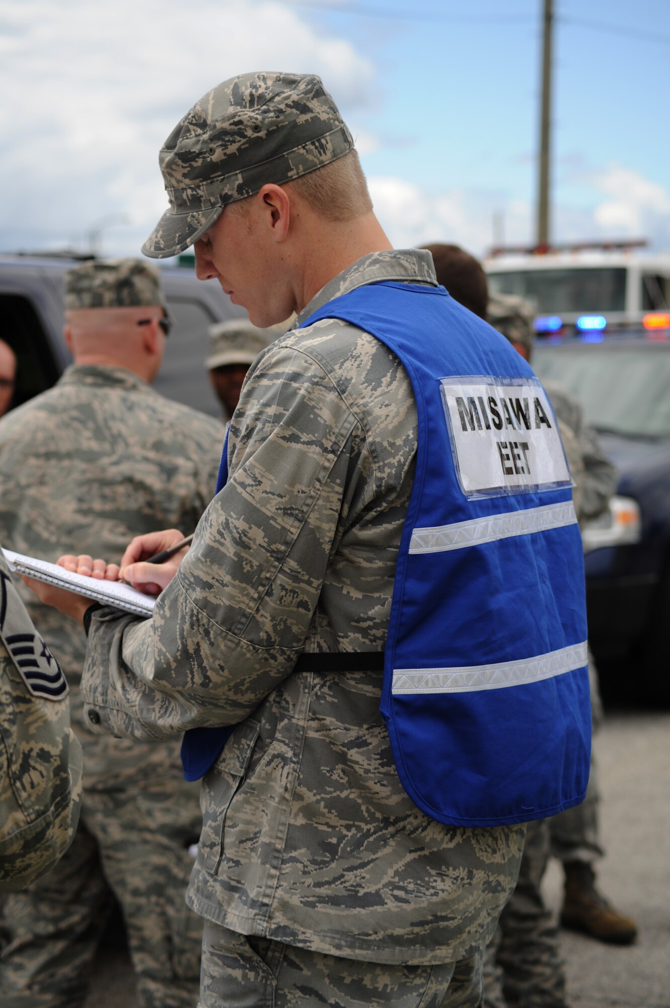 MISAWA AIR BASE, Japan -- Capt. Reid Touchberry, 35th Civil Engineer Squadron exercise evaluation team member, evaluates the response team's performances during a training exercise June 15.  As experts in their field, EET members help design training scenarios and evaluate how participants respond to those scenarios.   (U.S. Air Force photo/Staff Sgt. April Quintanilla)
