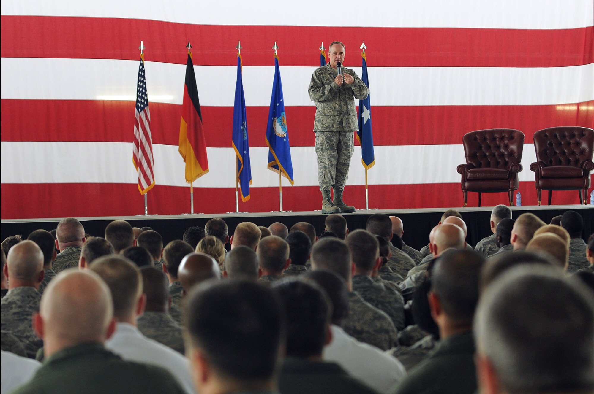 Gen. Mark A. Welsh III, U.S. Air Forces in Europe commander, speaks to Airmen during a commander?s call as part of his immersion with the 86th Airlift Wing, Ramstein Air Base, Germany, June 15. This visit gave General Welsh and Chief Master Sgt. David Williamson, USAFE command chief, the opportunity to see how the Airmen of the 86th AW support contingency operations and build strong partnerships throughout Europe and around the world. (U.S. Air force photo by Staff Sgt. Tyrona Lawson)