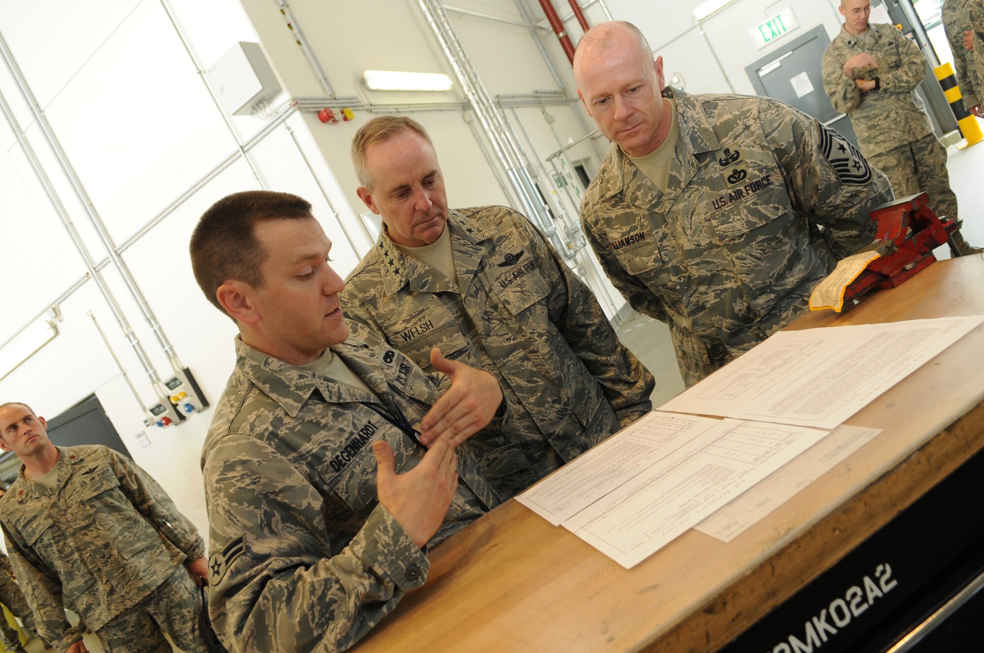 Airman 1st Class Nicholas Degenhardt, 86th Maintenance Squadron, briefs Gen. Mark A. Welsh III, U.S. Air Forces in Europe commander, and Chief Master Sgt. David Williamson, USAFE command chief, on the maintenance aircraft inspection process,during their immersion with the wing June 15.  This visit gave General Welsh along with Chief Master Sgt. David Williamson, USAFE command chief, the opportunity to see how the Airmen of the 86th AW support contingency operations and build strong partnerships capacities in Europe and throughout the world. (U.S. Air force photo by Staff Sgt. Tyrona Lawson)