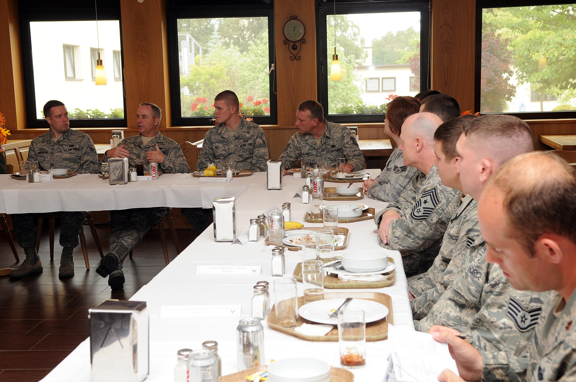 U.S. Air Force Gen. Mark A. Welsh III, U.S. Air Forces in Europe commander, and Chief Master Sgt. David Williamson, USAFE command chief, speak with Airmen during lunch at the Rheinland Inn as part of their immersion with the 86th Airlift Wing, Ramstein Air Base, Germany, June 15. The day was the first ?official? visit since the general assumed command of USAFE and gave General Welsh and Chief Williamson the opportunity to see how the Airmen of the 86th AW support contingency operations and build strong partnerships capacities in Europe and throughout the world. (U.S. Air force photo by Staff Sgt. Tyrona Lawson)