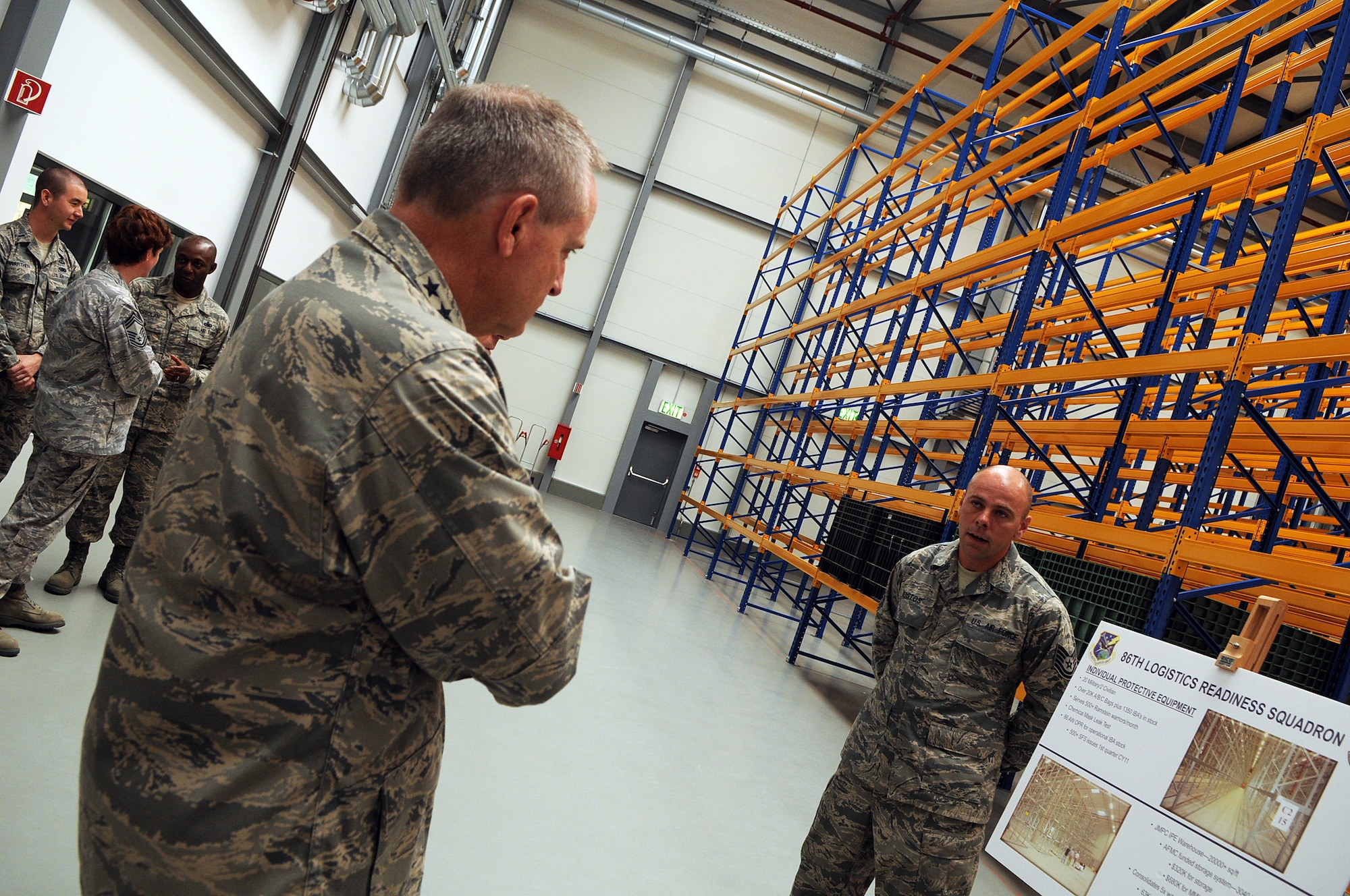Tech.Sgt. Matt Kostos, 86th Logistics Readiness Squadron, briefs Gen. Mark A. Welsh III, U.S. Air Forces in Europe commander, on plans for a new Individual Protective Equipment facility, during the general?s visit of the 86th Airlift Wing, Ramstein Air Base, Germany, June 15. This visit gave General Welsh along with Chief Master Sgt. David Williamson, USAFE command chief, the opportunity to see how the Airmen of the 86th AW support contingency operations and build strong partnerships capacities in Europe and throughout the world. (U.S. Air force photo by Staff Sgt. Tyrona Lawson)