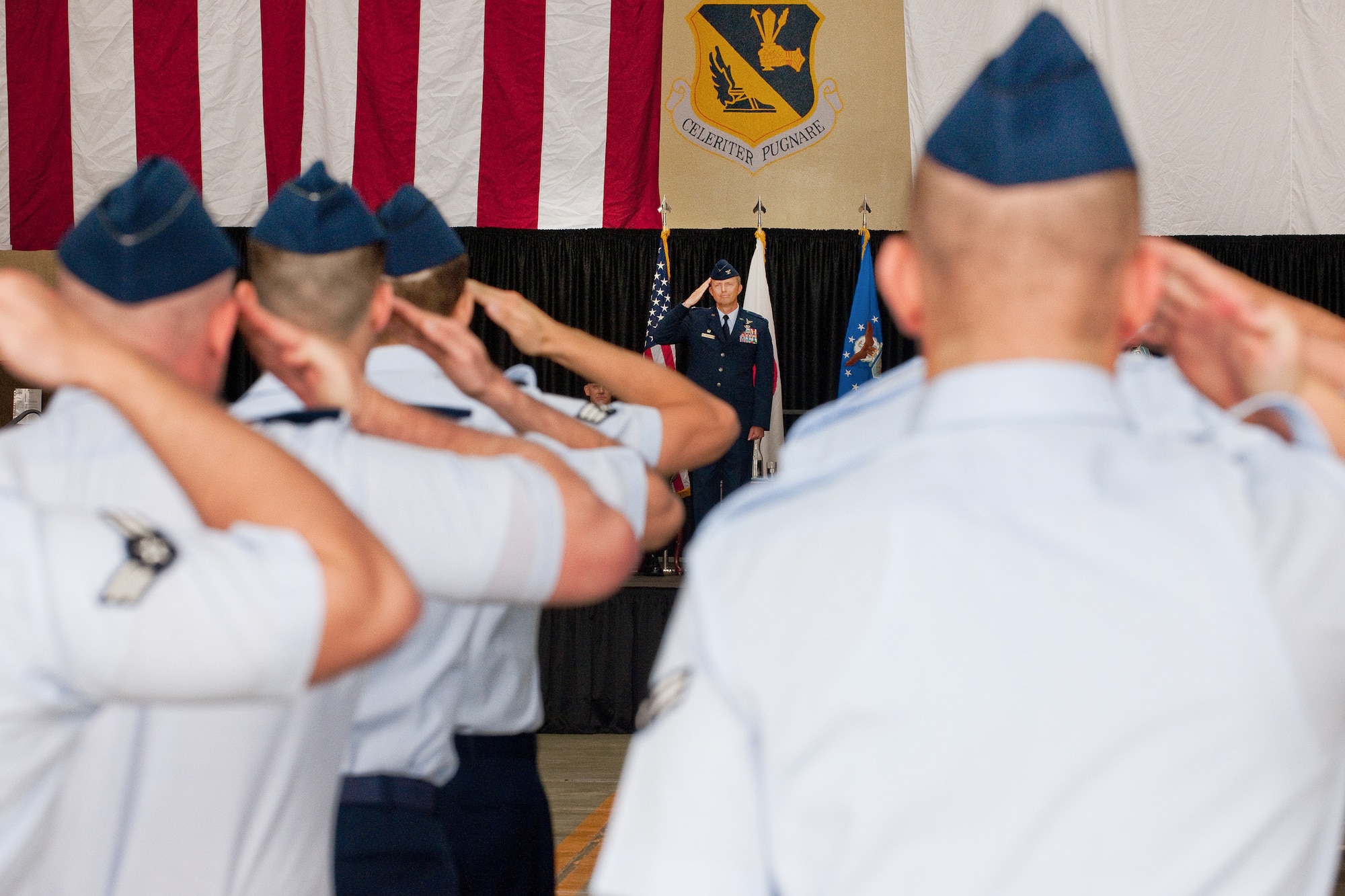 YOKOTA AIR BASE, Japan -- Col. David Gould II, incoming commander of the 374th Operations Group, renders his first salute to the men and women of the 374th OG during the assumption of command ceremony June 16, 2011. (U.S. Air Force photo/Osakabe Yasuo)