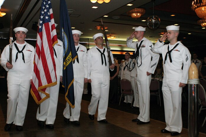 Members of the Corpsmen Color Guard parade the colors during the opening ceremony of the 2011 Navy Hospital Corpsmen Ball at the Club Iwakuni ballroom here June 17. The Vietnam War was the theme for the ball this year. The guest speak was Dr. John E. Fortunato. Fortunato spoke::r::::n::of his time serving in the U.S. Army along side Navy corpsmen and how those experiences shaped him.