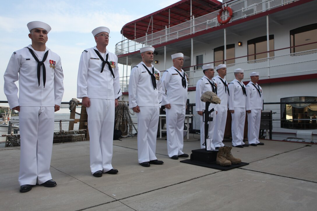 Sailors conduct Last Roll Call, the time-honored tradition of commemorating fallen comrades, during the 113th Corpsmen Birthday Ball celebration on the docks of Henrietta III riverboat in Wilmington, June 17.