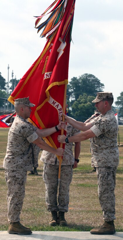 Lt. Col. Daniel T. Canfield Jr. relinquishes his duties as commanding officer of 1st Battalion, 8th Marine Regiment, 2nd Marine Division, to Lt. Col. Kevin C. Trimble, during a change during a change of command ceremony, June 17, 2011, aboard Marine Corps Base Camp Lejeune, N.C. The Marines and sailors of 1/8 recently returned from Afghanistan where they fought numerous battles in their area of operations.