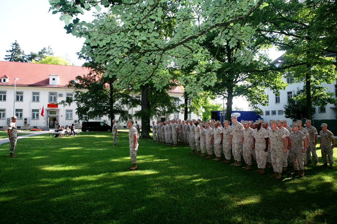 The Marines and Sailors of Marine Forces Europe and Marine Forces Africa stand in formation as they await the ceremony that will create a headquarters company for the two separate commands here June 17.::r::::n::  ::r::::n::