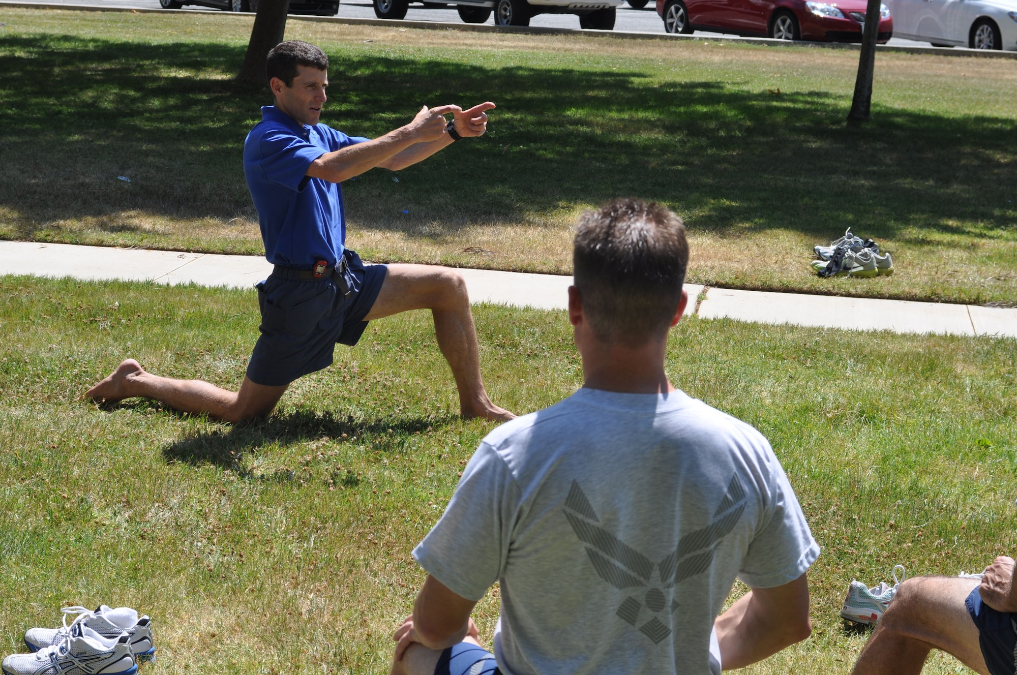 Dr. Mark Cucuzzella, the chief medical consultant for the Air Force Marathon and 2006 Air Force Marathon winner, demonstrates running form during a clinic at March Air Reserve Base, Calif., June 12, 2011.  The clinic was a joint effort between the 452nd Air Mobility Wing and the March FITT organization. (U.S. Air Force photos/Staff Sgt. Kevin Chandler)