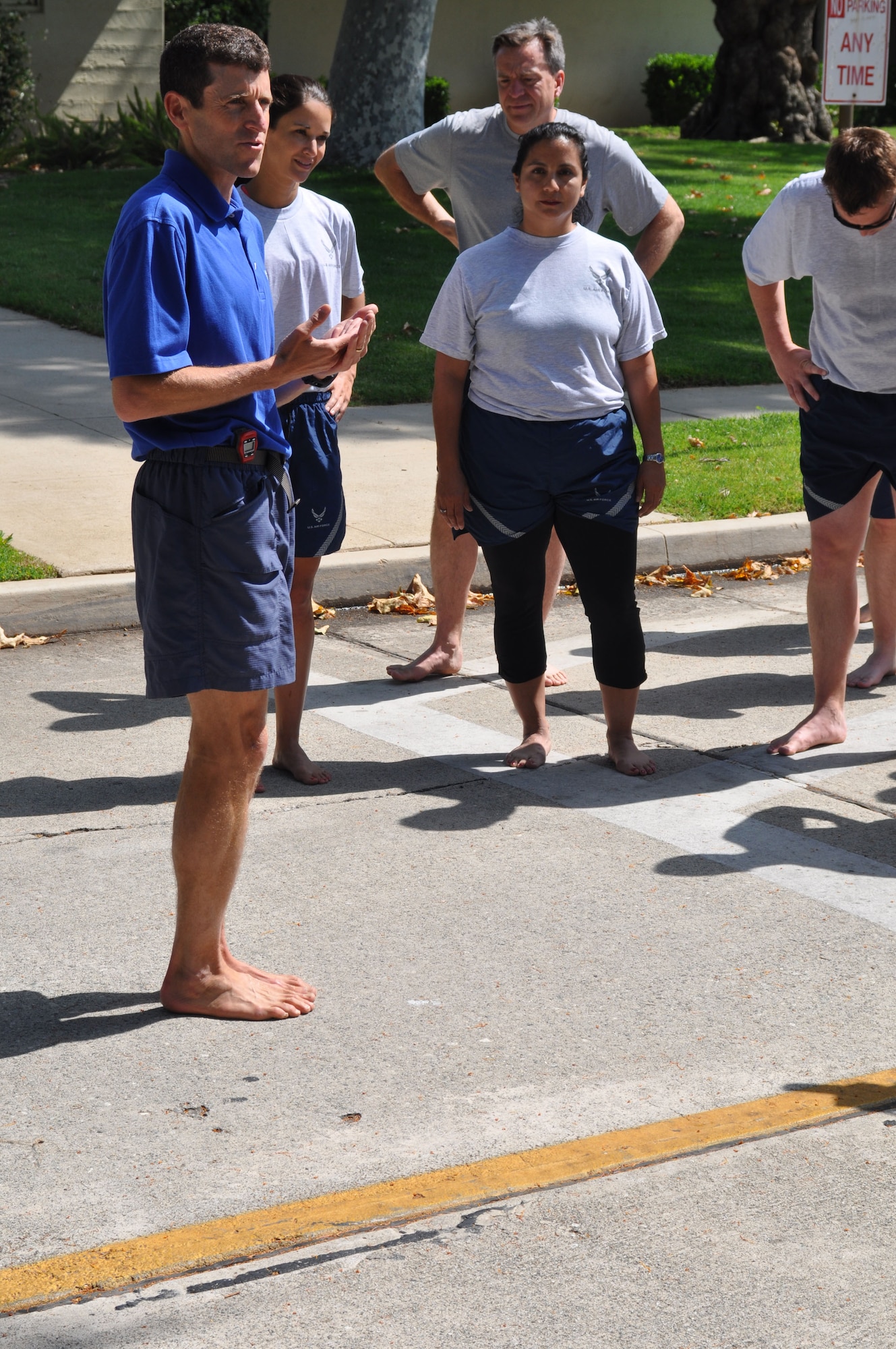 Dr. Mark Cucuzzella, the chief medical consultant for the Air Force Marathon and 2006 Air Force Marathon winner, speaks to runners during a running clinic at March Air Reserve Base, Calif., June 12, 2011.  The clinic was a joint effort between the 452nd Air Mobility Wing and the March FITT organization. (U.S. Air Force photos/Staff Sgt. Kevin Chandler)