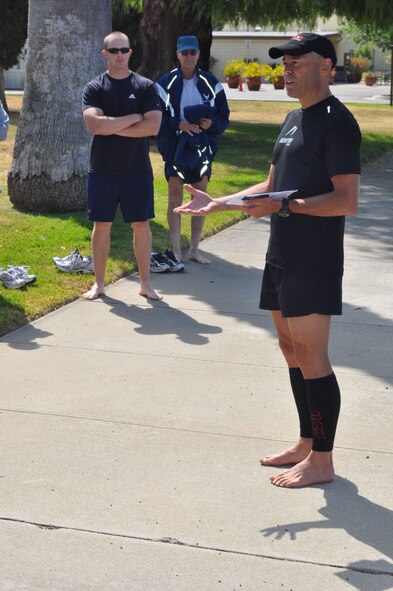 Ian Adamson, ultra-athlete and three-time record holder, instructs runners during a running clinic March Air Reserve Base, Calif., June 12, 2011.  The clinic was a joint effort between the 452nd Air Mobility Wing and the March FITT organization. (U.S. Air Force photos/Staff Sgt. Kevin Chandler)