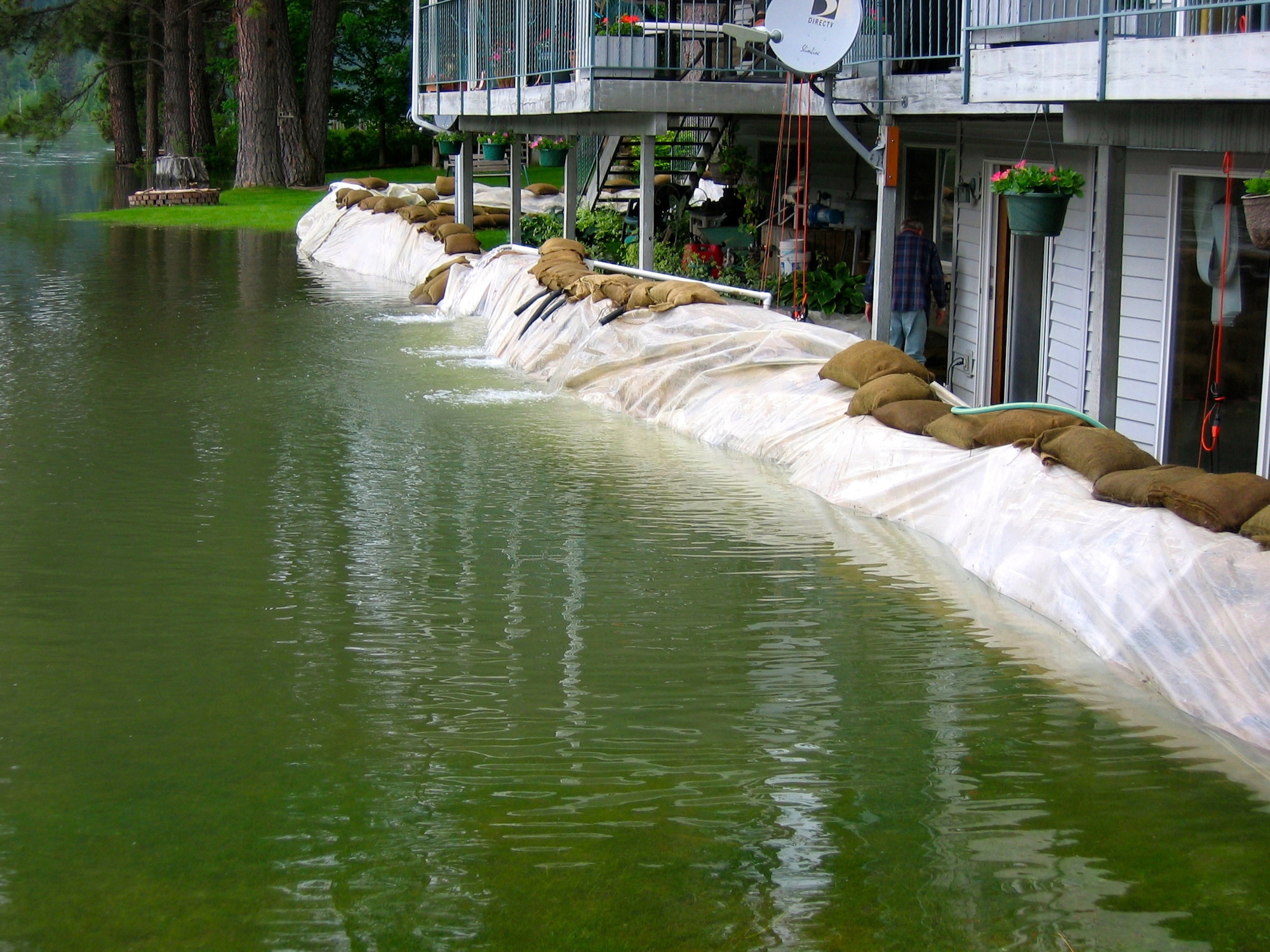 The home of Mr. and Mrs. Ken and Carol Wendt shown June 17 after the Pend Oreille River near Cusick, Wash. continues to rise. Forty student candidates and instructors from the 336th Training Group Survival Evasion Resistance Escape School at Fairchild filled roughly 10,000 sandbags in Pend Oreille County, Wash. on June 9, saving three homes from being flooded and making elderly homeowners extremely grateful and proud of the Air Force Airmen.  