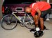 Staff Sgt. Terrance Raybon, 2nd Medical Support Squadron, puts on his sneakers outside his residence before bicycling to work on Barkdale Air Force Base, La., Jun 15. Sergeant Raybon chose to begin to cycle to and from work so his family would be able to eliminate debt. (U.S. Air Force photo/Senior Airman Kristin High)(RELEASED)