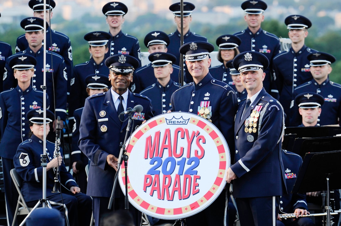 Macy’s Parade representatives presented the official drumhead to Maj. Gen. Darren W. McDew, Col. A. Phillip Waite and Lt. Col. Raymond Powell  June 4, 2011, at The Air Force Memorial in Arlington, Va., after receiving an invitation for The U.S. Air Force Band and U.S. Air Force Honor Guard to perform during the 2012 parade. (U.S. Air Force photo/Staff Sgt. Raymond Mills)