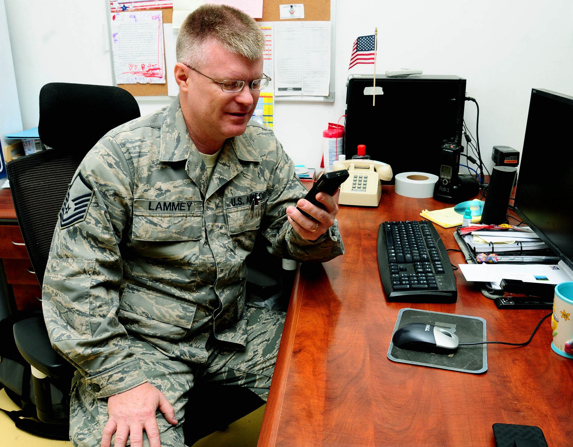 Master Sgt. Roger Lammey, a 332nd Air Expeditionary Wing foreign object damage prevention monitor, speaks to his family via the Internet. (U.S. Air Force photo/Airman 1st Class Jeffrey Schultze)