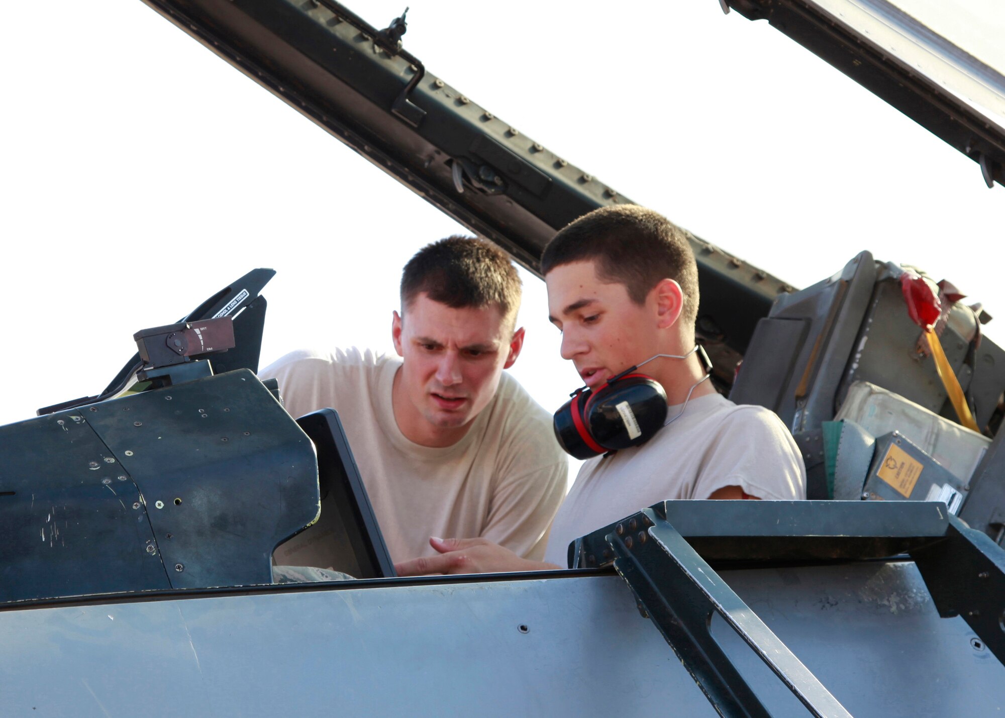 Sheppard AFB, TX-- Staff Sgt Thomas Clonts, instructor for 365th Training Squadron instructs Airmen Jeremy Mize on safe for entry and electric power on the F-16 by ensuring all switches are in the default settings on June 16. (USAF Photo Danny Webb)