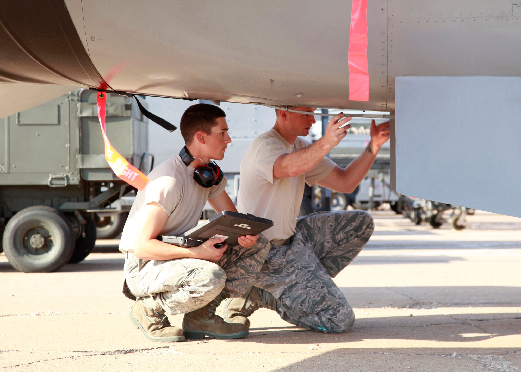 Sheppard AFB, TX--Staff Sgt Thomas Clonts; instructor from the 365th Training Squadron instructs Airman Jeremy Mize on the importance of the F-16 resting hook on June 16. (USAF Photo Danny Webb) 110616-F-DL404-001
