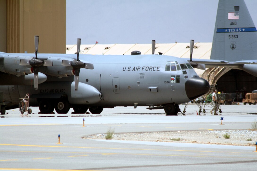 Aircraft maintenance Airmen work on C-130 Hercules aircraft deployed with the 774th Expeditionary Airlift Squadron on the flightline at Bagram Airfield, Afghanistan, on June 6, 2011.  The 774th EAS is part of the 455th Air Expeditionary Wing at Bagram Airfield. (U.S. Air Force Photo/Master Sgt. Scott T. Sturkol)
