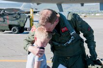 Lt. Col. Wes "Pappy" French, 173rd Fighter Wing Chief of Safety, hugs his son Carsen after French's 3,000 hour flight June 8, 2011 at Kingsley Field, Klamath Falls, Ore.  (U.S. Air Force Photo by Tech. Sgt Jennifer Shirar) RELEASED