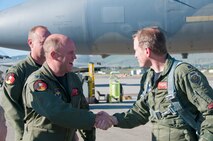 Lt. Col. Whit Sieben, 114th Fighter Squadron Commander, congratulates Lt. Col. Wes "Pappy" French, 173rd Fighter Wing Chief of Safety, after French's 3,000 hour flight June 8, 2011 at Kingsley Field, Klamath Falls, Ore.  (U.S. Air Force Photo by Tech. Sgt Jennifer Shirar) RELEASED