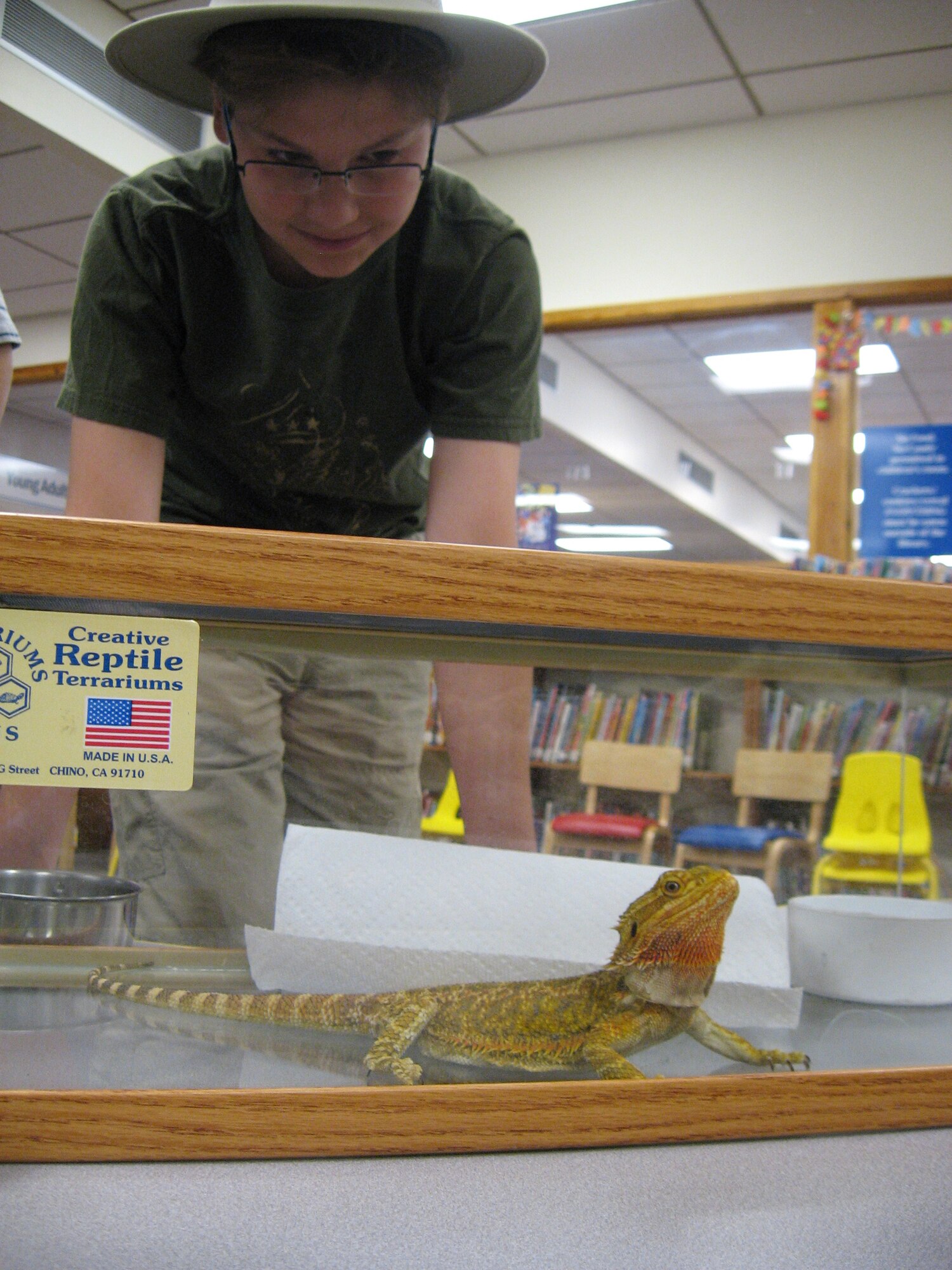 Christopher Robison observes a baby American alligator during an educational activity presented to the library’s summer reading club June 10 by volunteers from the ABQ BioPark Zoo.

Photo by Jonathan Rejent
