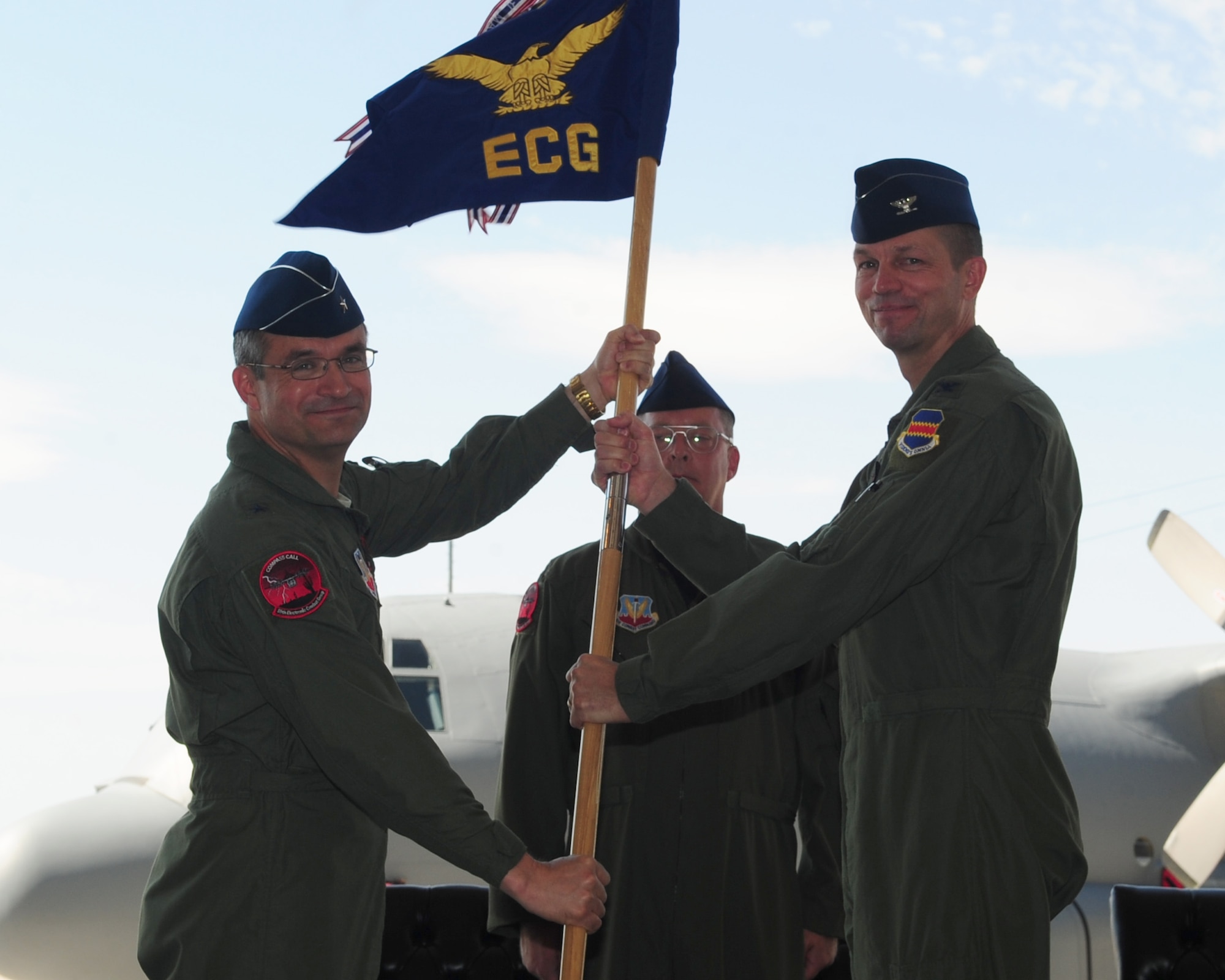 DAVIS-MONTHAN AIR FORCE BASE, Ariz. - Col. Richard Fojtik (right) receives the 55th Electronic Combat Group guidon from Brig. Gen. Donald Bacon, 55th Wing commander, during a change-of-command ceremony here June 17. Before taking command, Colonel Fojtik was Director of Strategic Plans and Programming for 12th Air Force (Air Forces Southern) based here. (U.S. Air Force photo/Airman 1st Class Jerilyn Quintanilla)