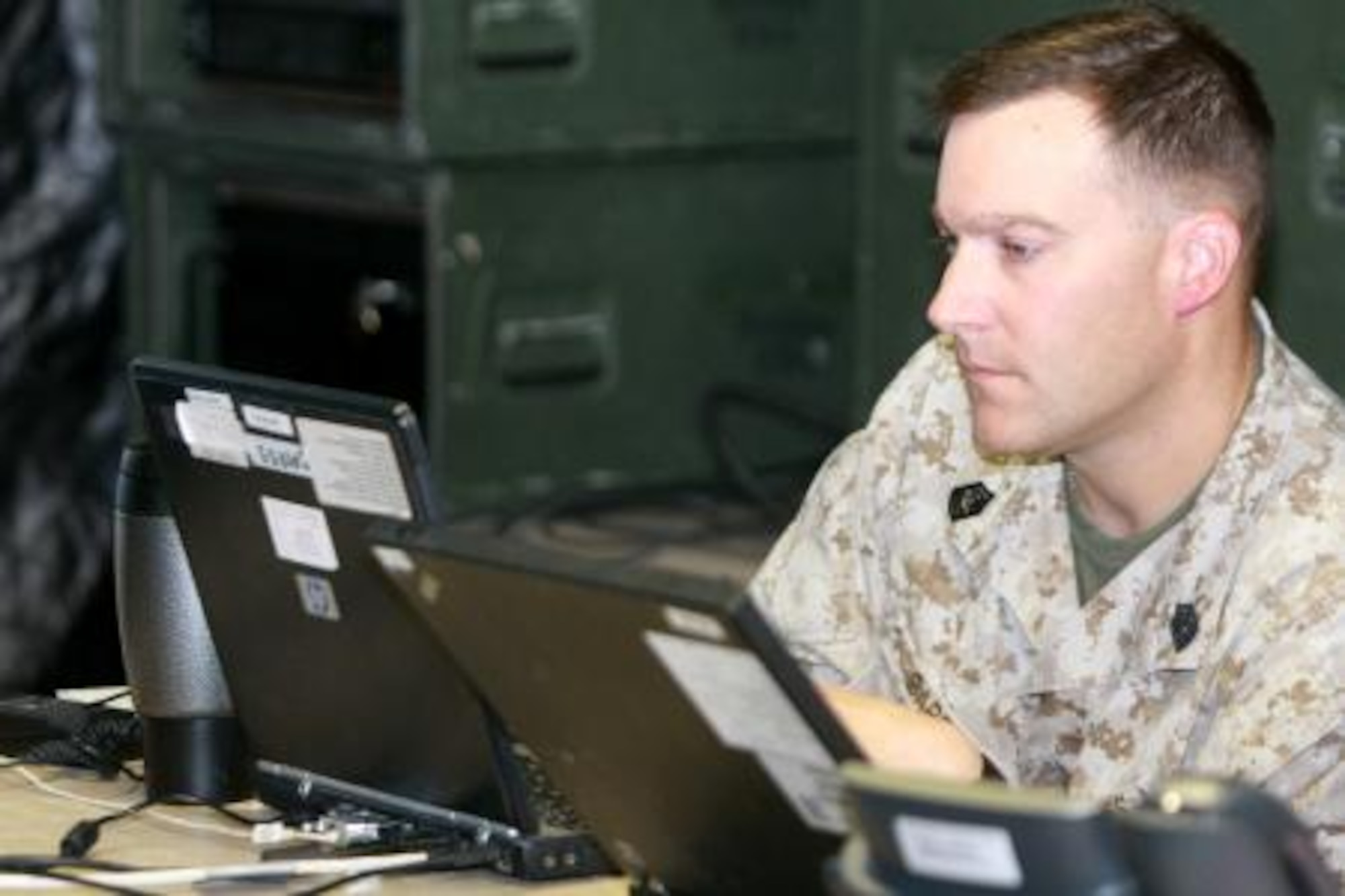 Marine Master Sgt. Brad Barber, senior air director, monitors a three-dimensional air defense radar while directing Air Force aggressor pilots as they simulate aerial combat during Exercise Northern Edge 11, June 14, 2011. Barber is assigned to Marine Air Control Squadron-1. (Photo by Marine Cpl. Marionne T. Mangrum) 




