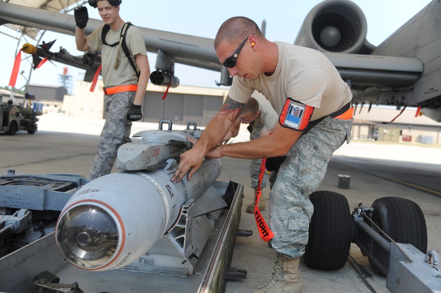 U.S. Air Force Staff Sgt. Thomas Mazzotta, 74th Aircraft Maintenance Unit load team chief, inspects an GBU-12 (guided bomb unit) after it was detached from an A-10C Thunderbolt II during a phase II operational readiness exercise at Moody Air Force Base, Ga., June 15. Sergeant Mazotta directed his Airmen on the step-by-step procedures throughout the inspection. (U.S. Air Force photo by Airman 1st Class Paul Francis/Released)