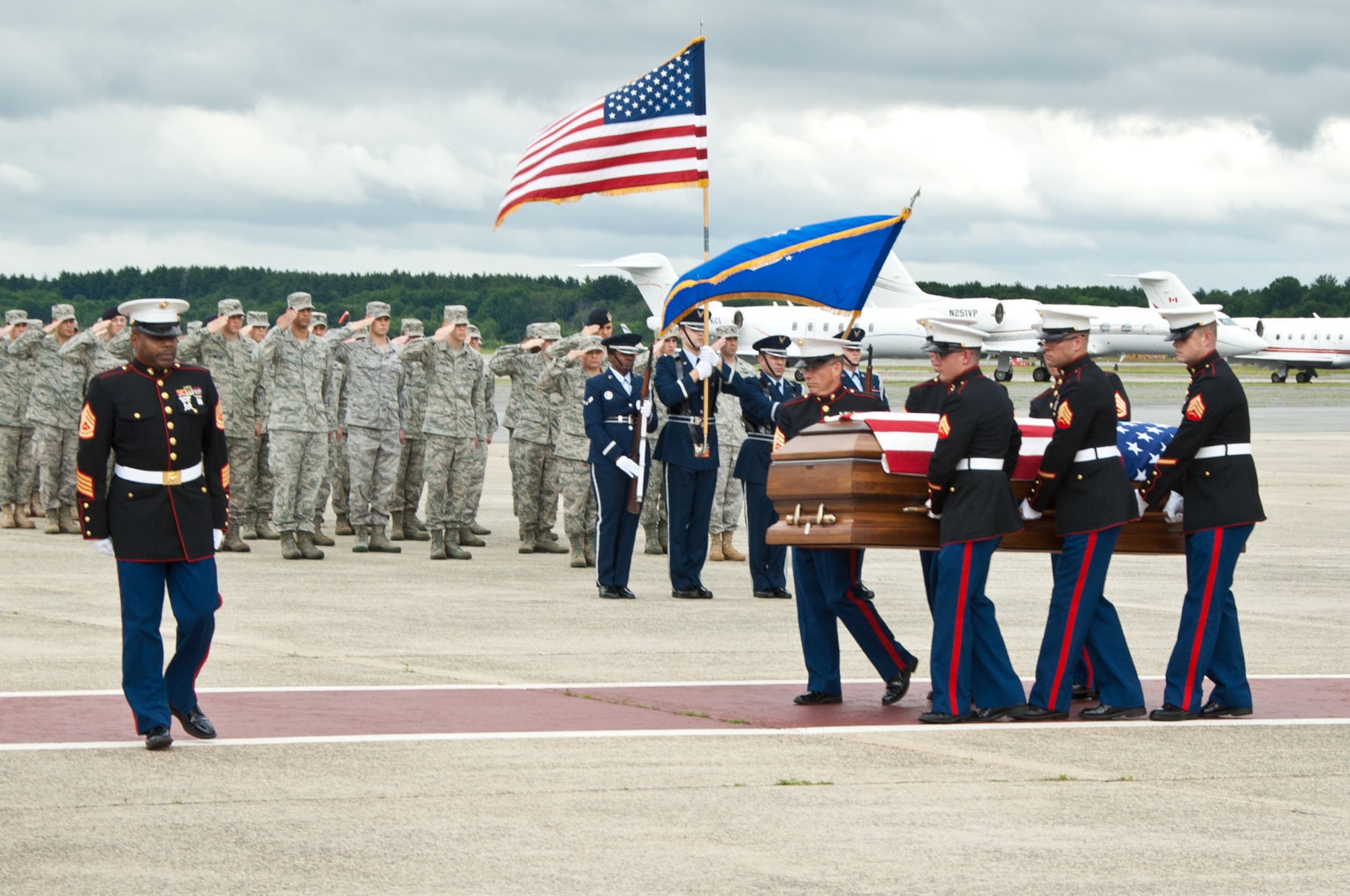 HANSCOM AIR FORCE BASE, Mass. – U.S. Marine Corps pallbearers carry the casket of Marine Corps Sgt. William J. Woitowicz during a dignified transfer ceremony on the flightline June 14. Sergeant Woitowicz, a member of the 2nd Marines Special Operations Battalion, died in combat in Afghanistan June 7. (U.S. Air Force photo by Rick Berry)