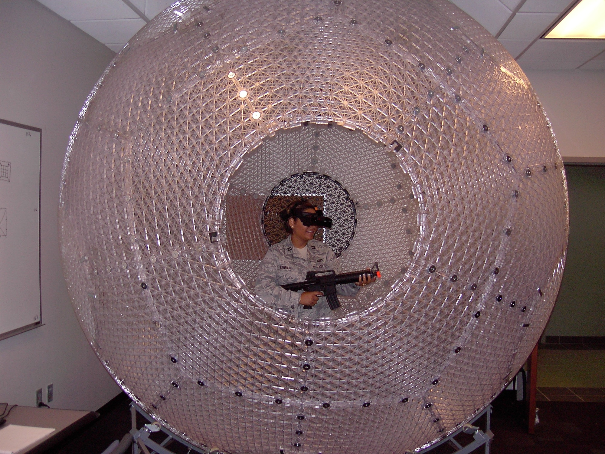 Capt. Cindy Serrano of the Air and Space Basic Course tries out a VirtuSphere locomotive simulator. The Squadron Officer College has two of the 20 devices in existence. (Air Force photo/Christopher Kratzer)