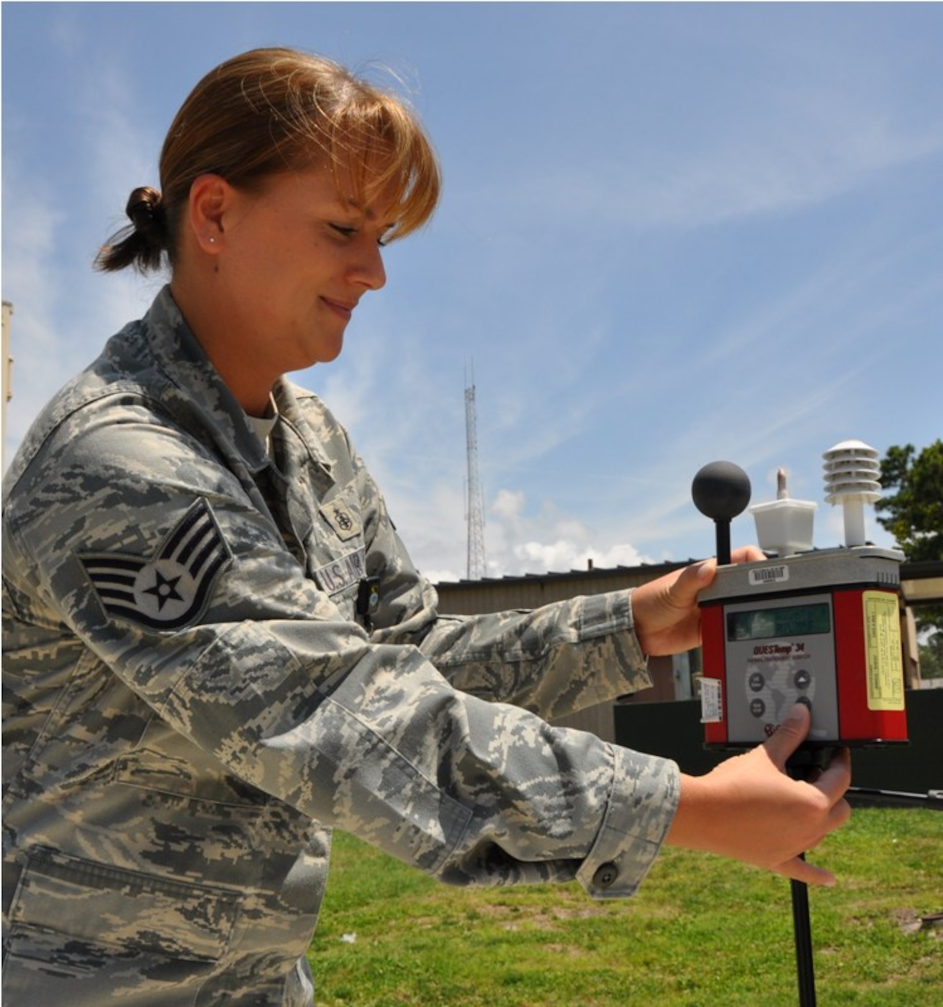 Staff Sgt. Lacy Johnson, 325th Aerospace Medicine Squadron bioenvironmental engineer technician, takes a temperature reading from the Wet Bulb Globe Temperature meter. The reading keeps Team Tyndall members aware of temperatures and flag conditions during the hot Florida summer months. (U.S. Air Force photo by Airman 1st Class Christopher Reel) 