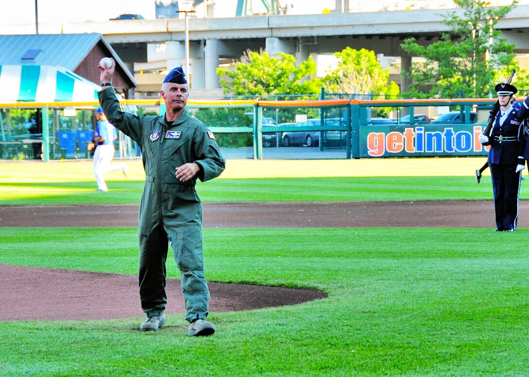 Officers representing the different branches of the armed forces throw out the first pitch during the Buffalo Bisons military appreciation day June 14, 2011, Buffalo, NY. Military members were recognized with a pregame ceremony that included the singing of the National Anthem and a multi-service color guard. (U.S. Air Force photo by Staff Sgt. Joseph McKee)