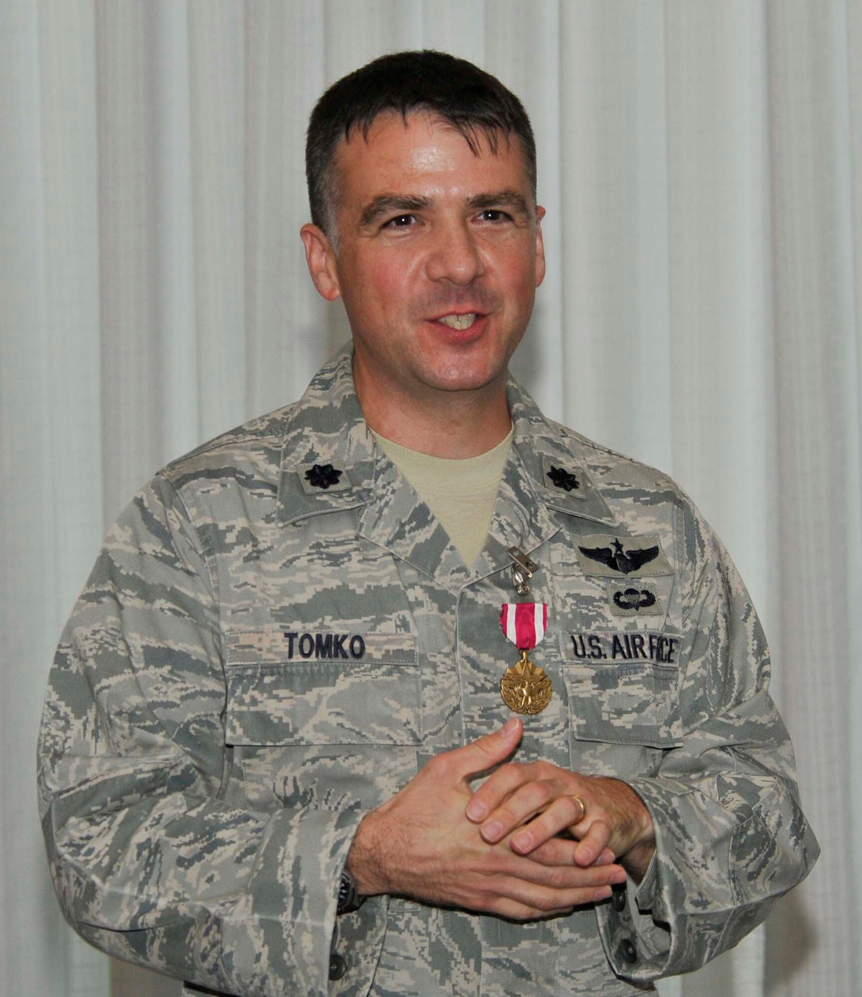 Lt. Col. Chuck Tomko, former Air Force Rescue Coordination Center commander, addresses the audience during the AFRCC's change of command ceremony at the Heritage Club June 15 after receiving the Meritorious Service Medal from Maj. Gen. Garry C. Dean, First Air Force commander. Colonel Tomko handed command of the AFRCC over to Lt. Col. Bob Russell, former AFRCC director of operations. (U.S. Air Force photo by Lisa Norman)