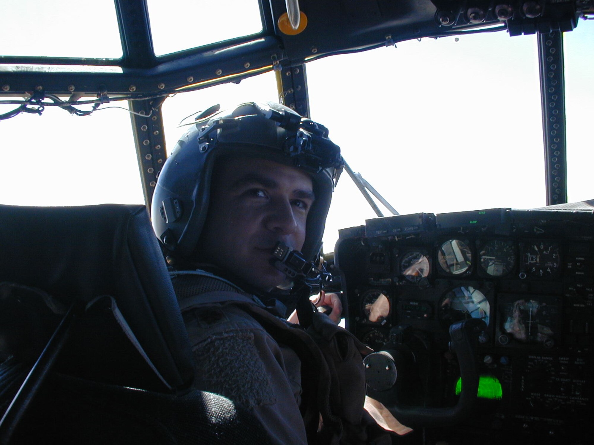 Lt. Col. Chuck Tomko, former Air Force Rescue Coordination Center commander, flies a mission over Iraq. Colonel Tomko handed command of the AFRCC over to Lt. Col. Bob Russell, former AFRCC director of operations, during a change of command ceremony at the Heritage Club June 15. (Courtesy photo)