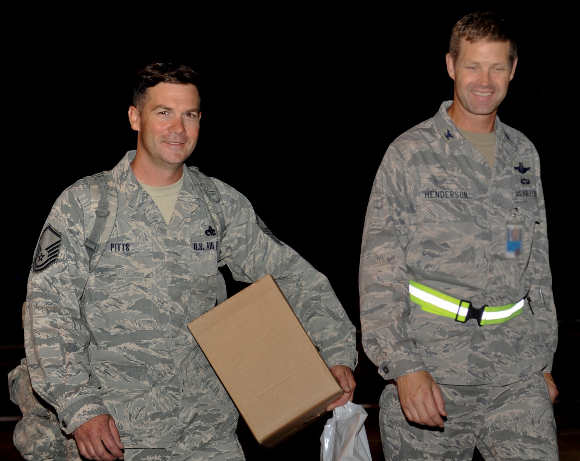 U.S. Air Force Col. Gary Henderson, 23rd Wing commander, talks with Master Sgt. Benjamin Pitts, 723rd Aircraft Maintenance Squadron member, at Moody Air Force Base, Ga., June 15. Sergeant Pitts, along with approximately 10 other 723rd AMXS members, returned from a deployment maintaining personnel recovery assets. (U.S. Air Force photo by Airman 1st Class Douglas Ellis/Released)
