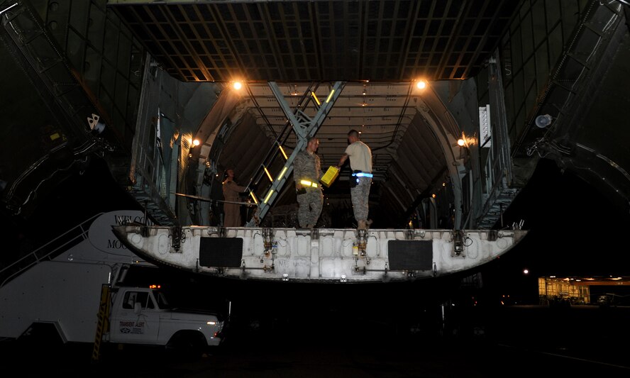 Members of the 723rd Aircraft Maintenance Squadron returning from a deployment to Afghanistan begin exiting a C-5 Galaxy at Moody Air Force Base, Ga., June 15. After exiting the aircraft, the Airmen were greeted by U.S. Air Force Col. Gary Henderson, 23rd Wing commander, and taken to see their families. (U.S. Air Force photo by Airman 1st Class Douglas Ellis/Released)
