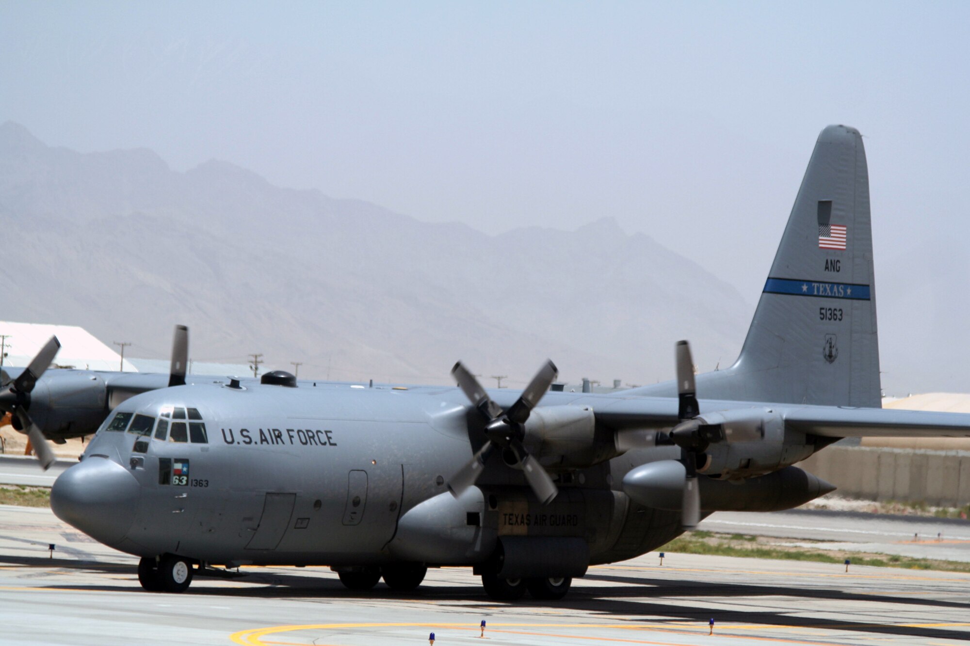 C-130 Hercules aircraft deployed with the 774th Expeditionary Airlift Squadron are shown on the flightline at Bagram Airfield, Afghanistan, on June 6, 2011.  The 774th EAS is part of the 455th Air Expeditionary Wing at Bagram Airfield. (U.S. Air Force Photo/Master Sgt. Scott T. Sturkol)