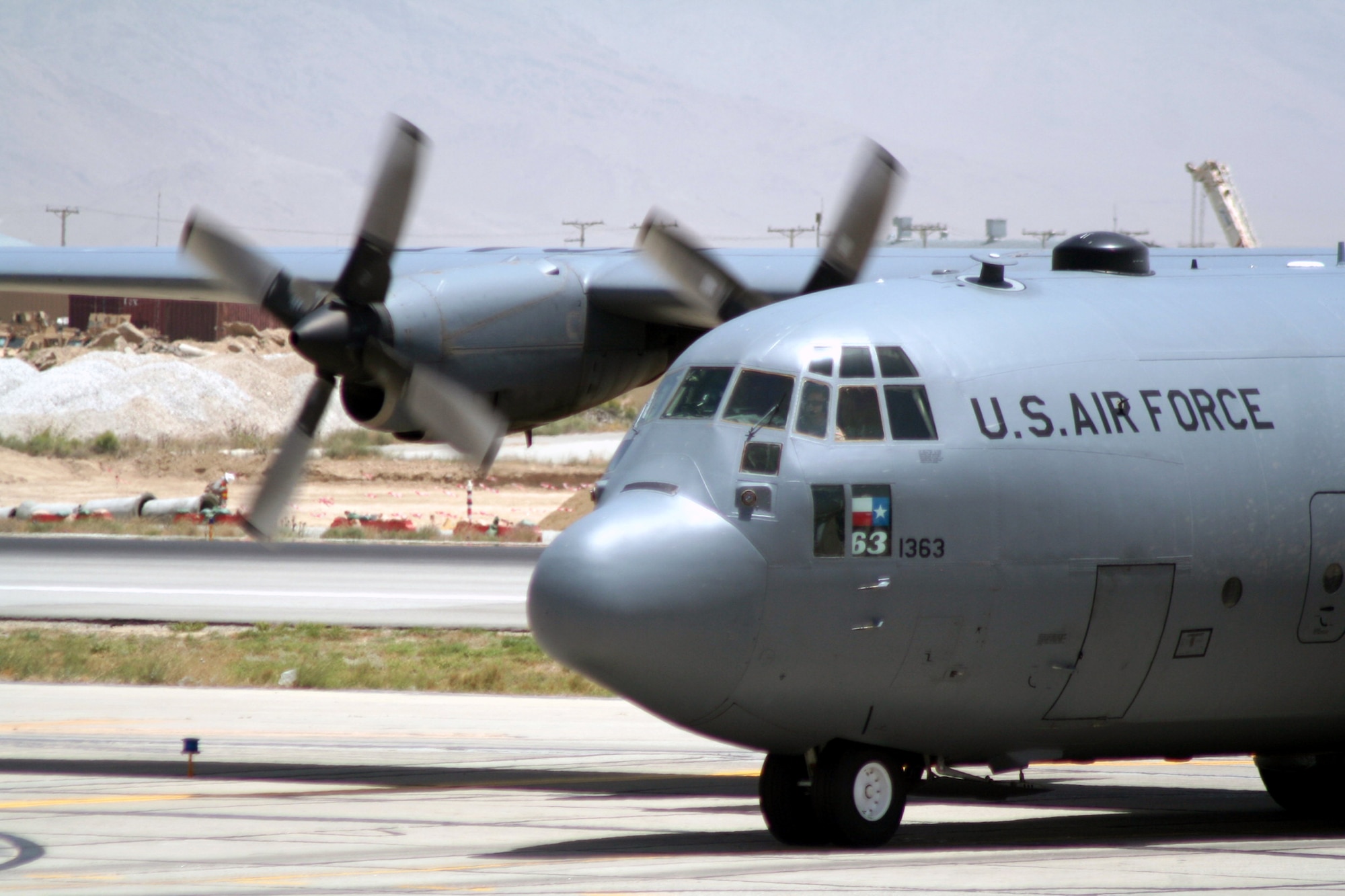 A C-130 Hercules deployed with the 774th Expeditionary Airlift Squadron taxis on the flightline after competing a combat airlift mission at Bagram Airfield, Afghanistan, on June 6, 2011.  The 774th EAS is part of the 455th Air Expeditionary Wing at Bagram Airfield. (U.S. Air Force Photo/Master Sgt. Scott T. Sturkol)