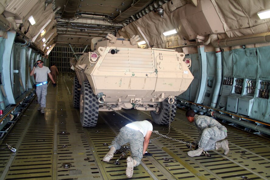 Air transportation Airmen load a C-5M Super Galaxy from Dover Air Force Base, Del., with cargo at Bagram Airfield, Afghanistan, on June 5, 2011. The C-5M's mission to Bagram was to complete the first Arctic overflight from Dover AFB to Bagram Airfield. The plane successfully landed at Bagram on June 6, 2011, then picked up cargo for the return trip back to the United States. (U.S. Air Force Photo/Master Sgt. Scott T. Sturkol) 

