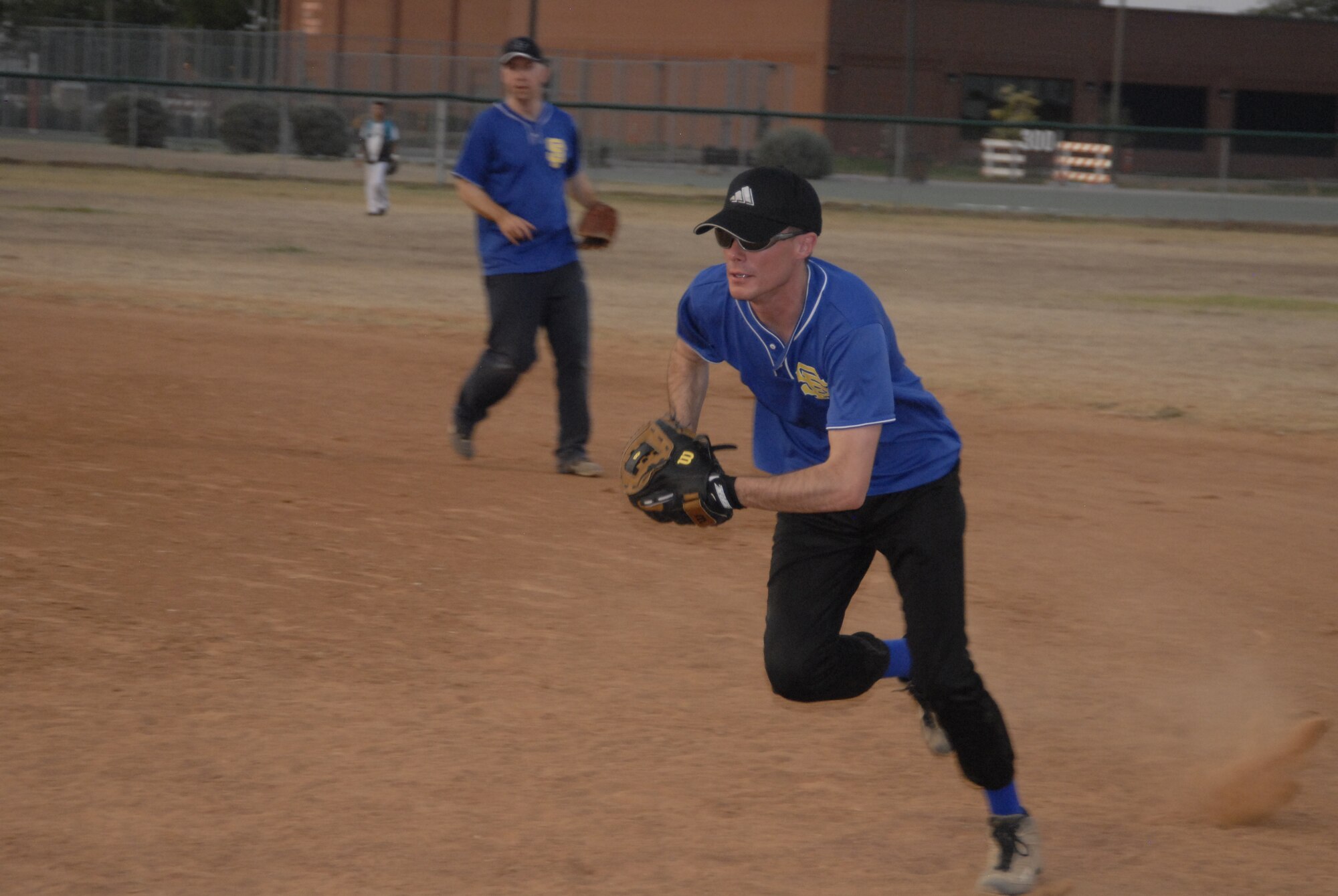 GOODFELLOW AIR FORCE BASE, Texas -- 1st Responders' first baseman Jeremy Davis runs to first for an out during the 2011 Base Intramural Softball Championship game June 15.  After playing a three-game series, the 17th Security Forces Squadron 1st Responders defeated the 17th Training Support Squadron Tigers two games to one, bringing home the Championship title.  (U.S. Air Force photo/Connie Hempel)