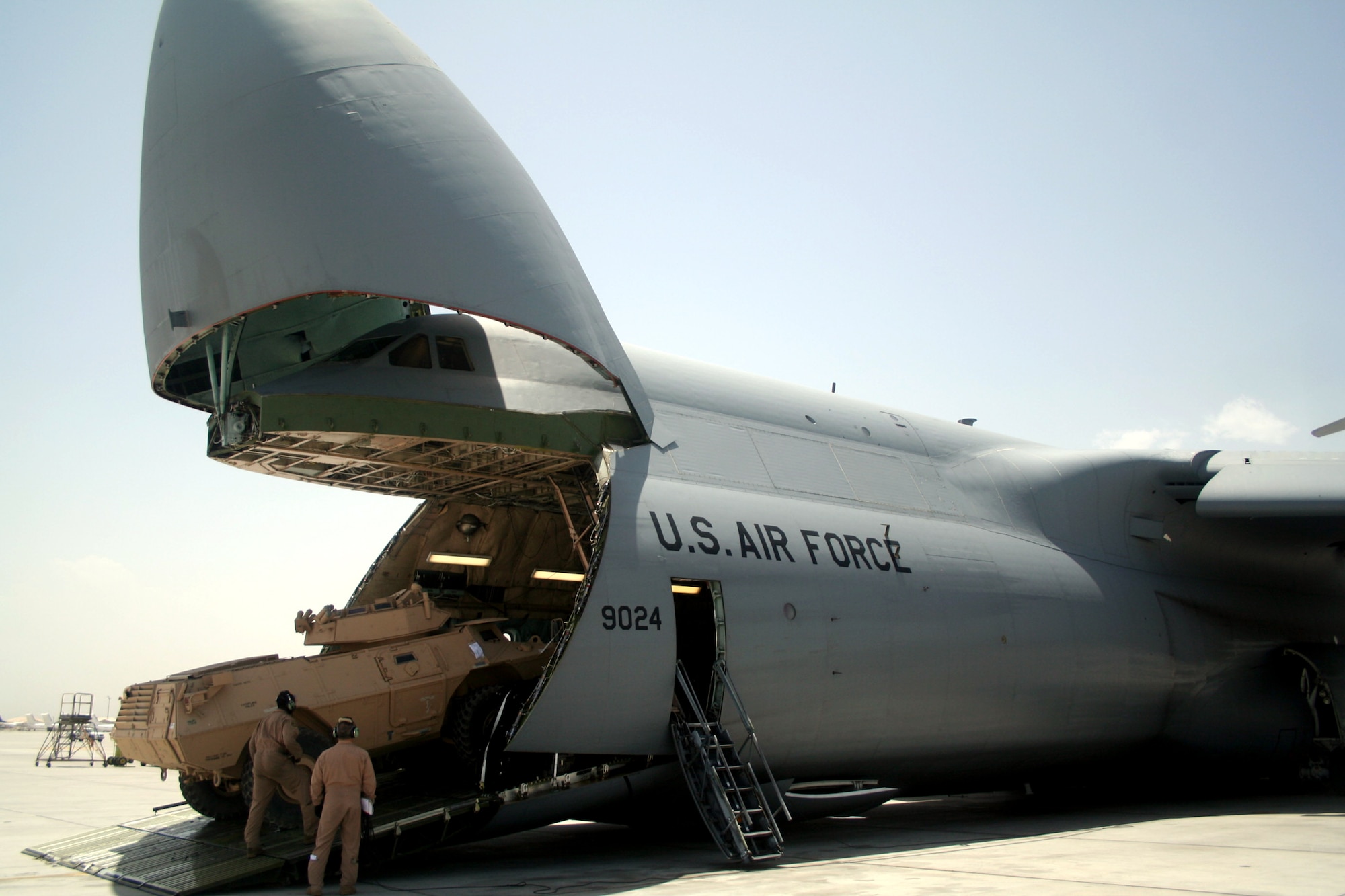 Air transportation Airmen load a C-5M Super Galaxy from Dover Air Force Base, Del., with cargo at Bagram Airfield, Afghanistan, on June 5, 2011. The C-5M's mission to Bagram was to complete the first Arctic overflight from Dover AFB to Bagram Airfield. The plane successfully landed at Bagram in just over 15 hours on June 6, 2011, then picked up cargo for the return trip back to the United States. (U.S. Air Force Photo/Master Sgt. Scott T. Sturkol)