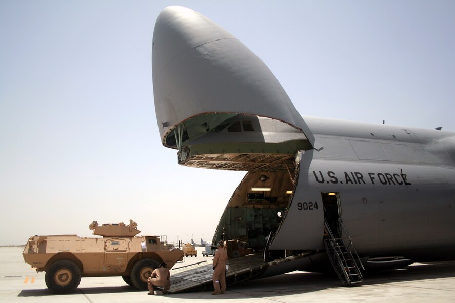 Air transportation Airmen load a C-5M Super Galaxy from Dover Air Force Base, Del., with cargo at Bagram Airfield, Afghanistan, on June 5, 2011. The C-5M's mission to Bagram was to complete the first Arctic overflight from Dover AFB to Bagram Airfield. The plane successfully landed at Bagram in just over 15 hours on June 6, 2011, then picked up cargo for the return trip back to the United States. (U.S. Air Force Photo/Master Sgt. Scott T. Sturkol)