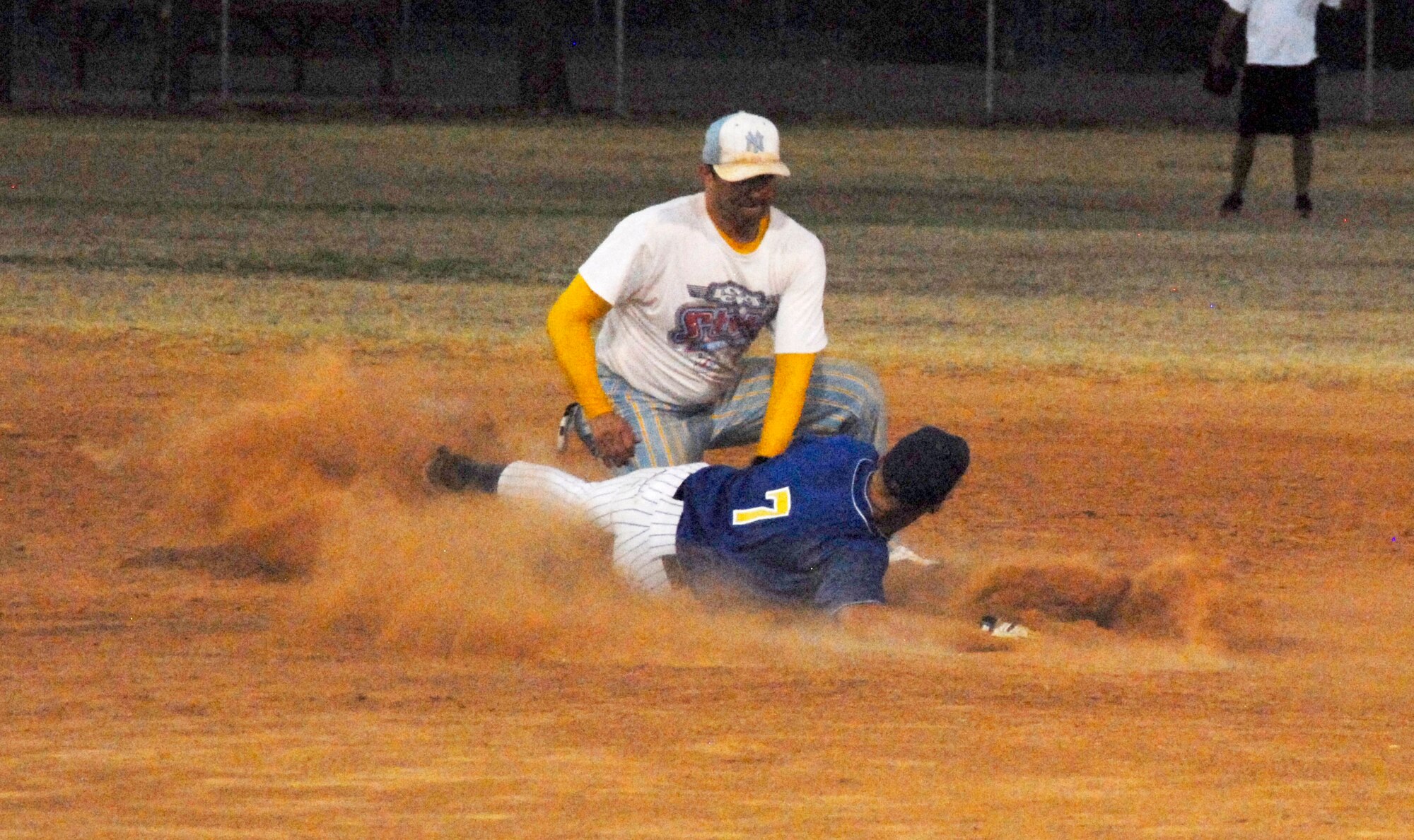GOODFELLOW AIR FORCE BASE, Texas -- 1st Responders' Jason Gibbs, tries to slide to second before getting tagged out by Tigers' short stop/left-fielder James Gray during the 2011 Base Intramural Softball Championship game June 15.  The 1st Responders defeated the Tigers two games to one, taking home this year's Championship title.  (U.S. Air Force photo/Connie Hempel)