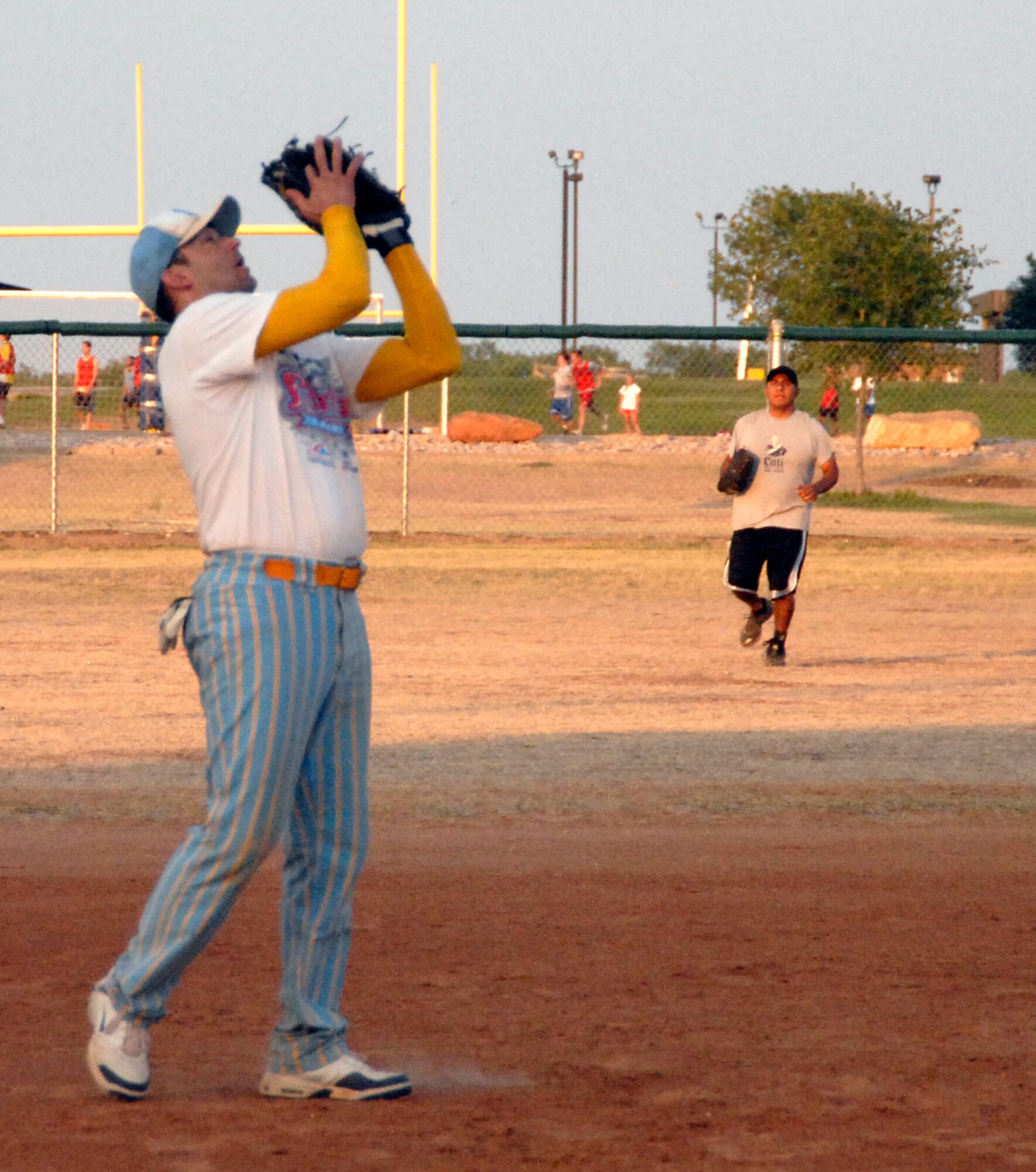 GOODFELLOW AIR FORCE BASE, Texas -- Tigers' short stop James Gray catches an easy out during the 2011 Base Intramural Softball Championship game June 15 where the 17th Training Support Squadron Tigers faced the 17th Security Forces Squadron 1st Responders.  Although the Tigers dominated Game 2 of the three-game series, they weren't able to stop the 1st Responders from taking home the Championship title.  (U.S. Air Force photo/Connie Hempel)