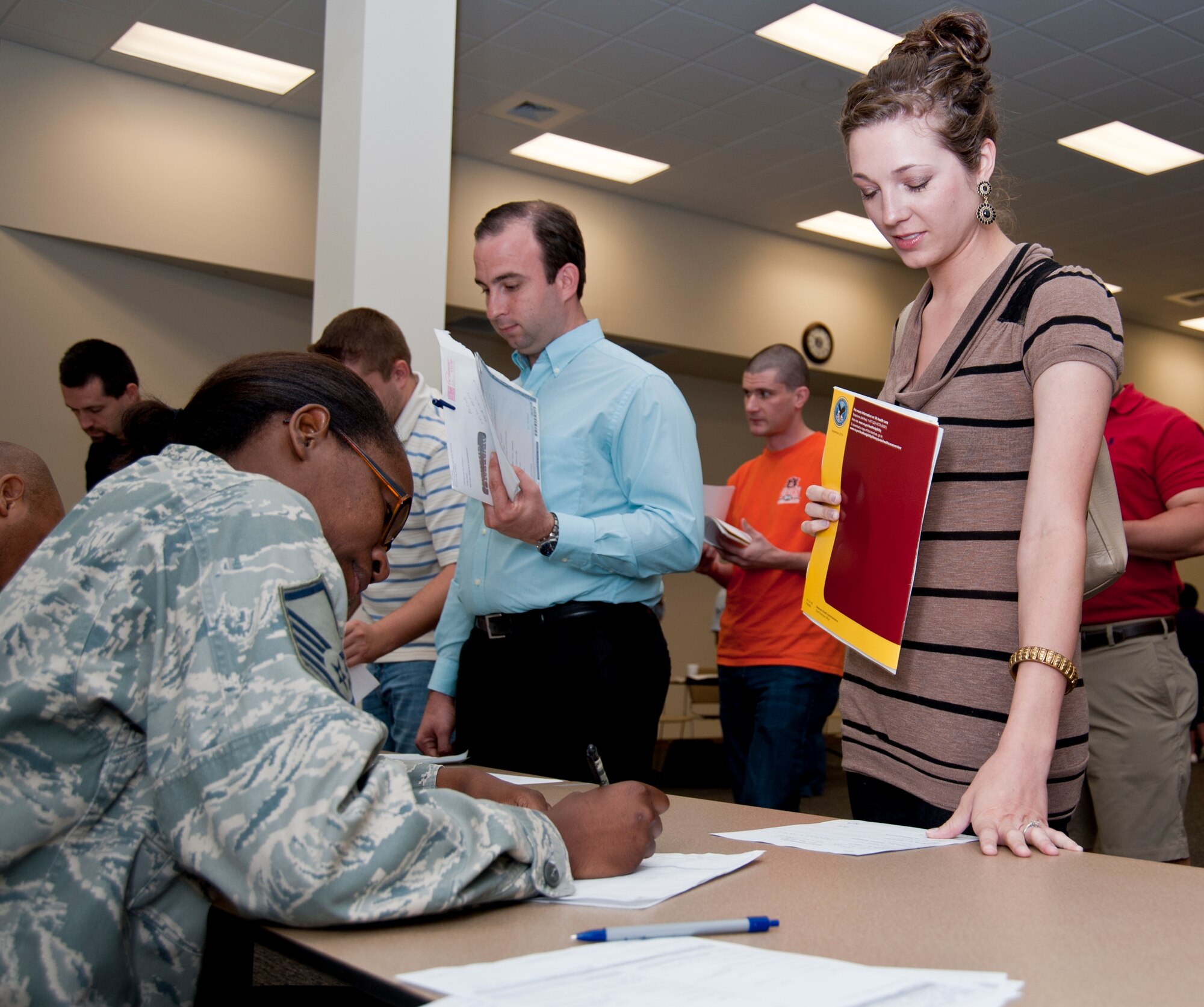 Staff Sgt. Hailey Ross, an Inactive Ready Reservist from Meridian, Miss., verifies medical records with Master Sgt. Heidi Curry, 403rd Aeromedical Staging Squadron.  Sergeant Ross also spoke with recruiters during the muster about the possibility of returning to the active Reserve. (U.S. Air Force photo by Dhiana McKaig)