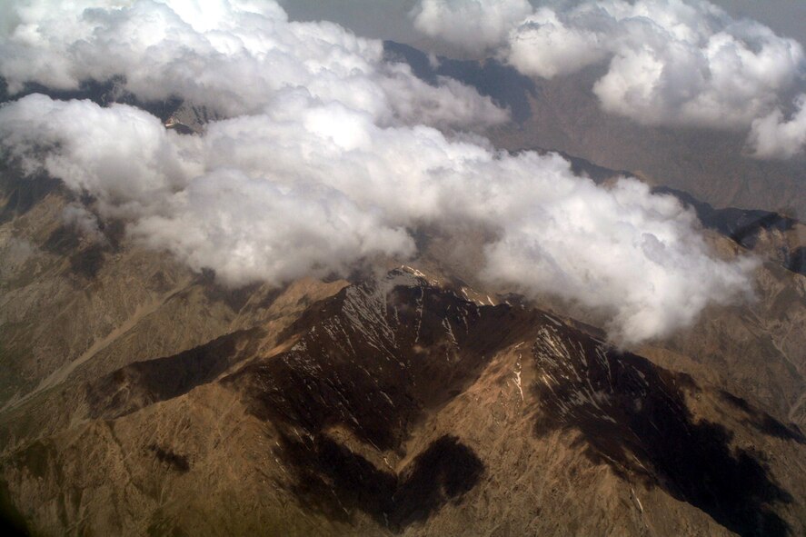 The countryside of Afghanistan can be seen through the window of a C-5M Super Galaxy during an airlift mission on June 6, 2011.  The C-5M was on the first direct delivery airlift mission that went through the Arctic Circle from Dover Air Force Base, Del., to Bagram Airfield, Afghanistan, between June 5-6, 2011. (U.S. Air Force Photo/Master Sgt. Scott T. Sturkol)