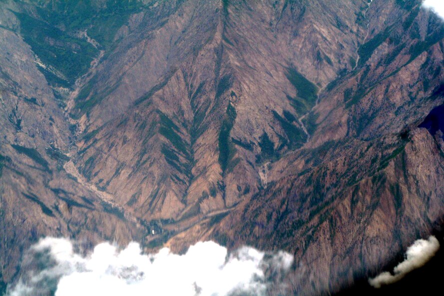 The countryside of Afghanistan can be seen through the window of a C-5M Super Galaxy during an airlift mission on June 6, 2011.  The C-5M was on the first direct delivery airlift mission that went through the Arctic Circle from Dover Air Force Base, Del., to Bagram Airfield, Afghanistan, between June 5-6, 2011. (U.S. Air Force Photo/Master Sgt. Scott T. Sturkol)