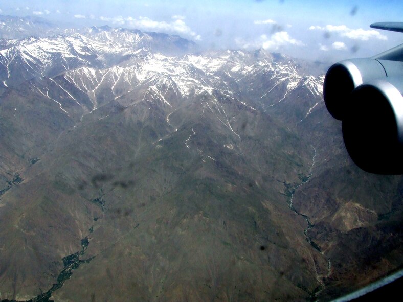 The countryside of Afghanistan can be seen through the window of a C-5M Super Galaxy during an airlift mission on June 6, 2011.  The C-5M was on the first direct delivery airlift mission that went through the Arctic Circle from Dover Air Force Base, Del., to Bagram Airfield, Afghanistan, between June 5-6, 2011. (U.S. Air Force Photo/Master Sgt. Scott T. Sturkol)