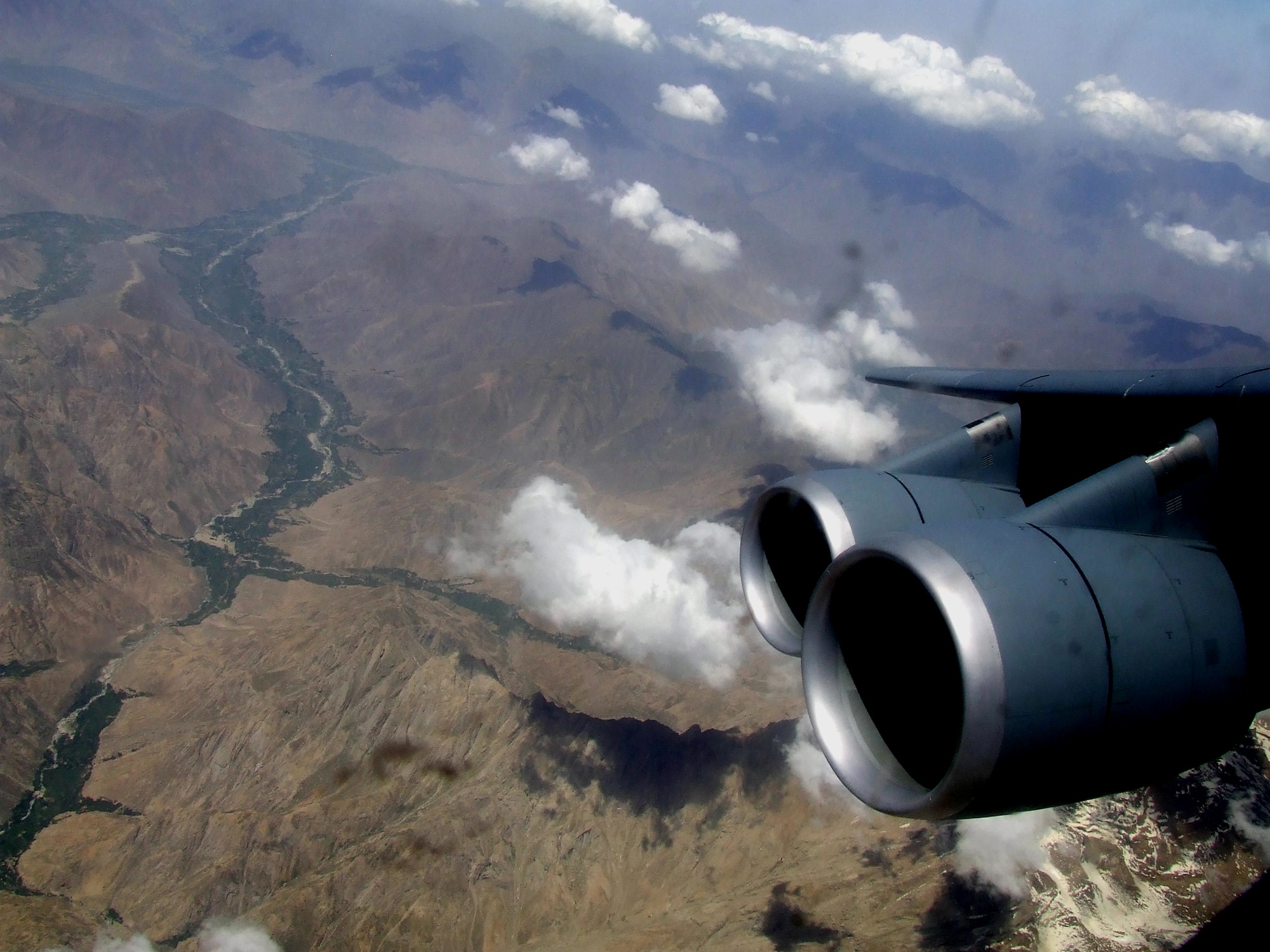 The countryside of Afghanistan can be seen through the window of a C-5M Super Galaxy during an airlift mission on June 6, 2011.  The C-5M was on the first direct delivery airlift mission that went through the Arctic Circle from Dover Air Force Base, Del., to Bagram Airfield, Afghanistan, between June 5-6, 2011. (U.S. Air Force Photo/Master Sgt. Scott T. Sturkol)