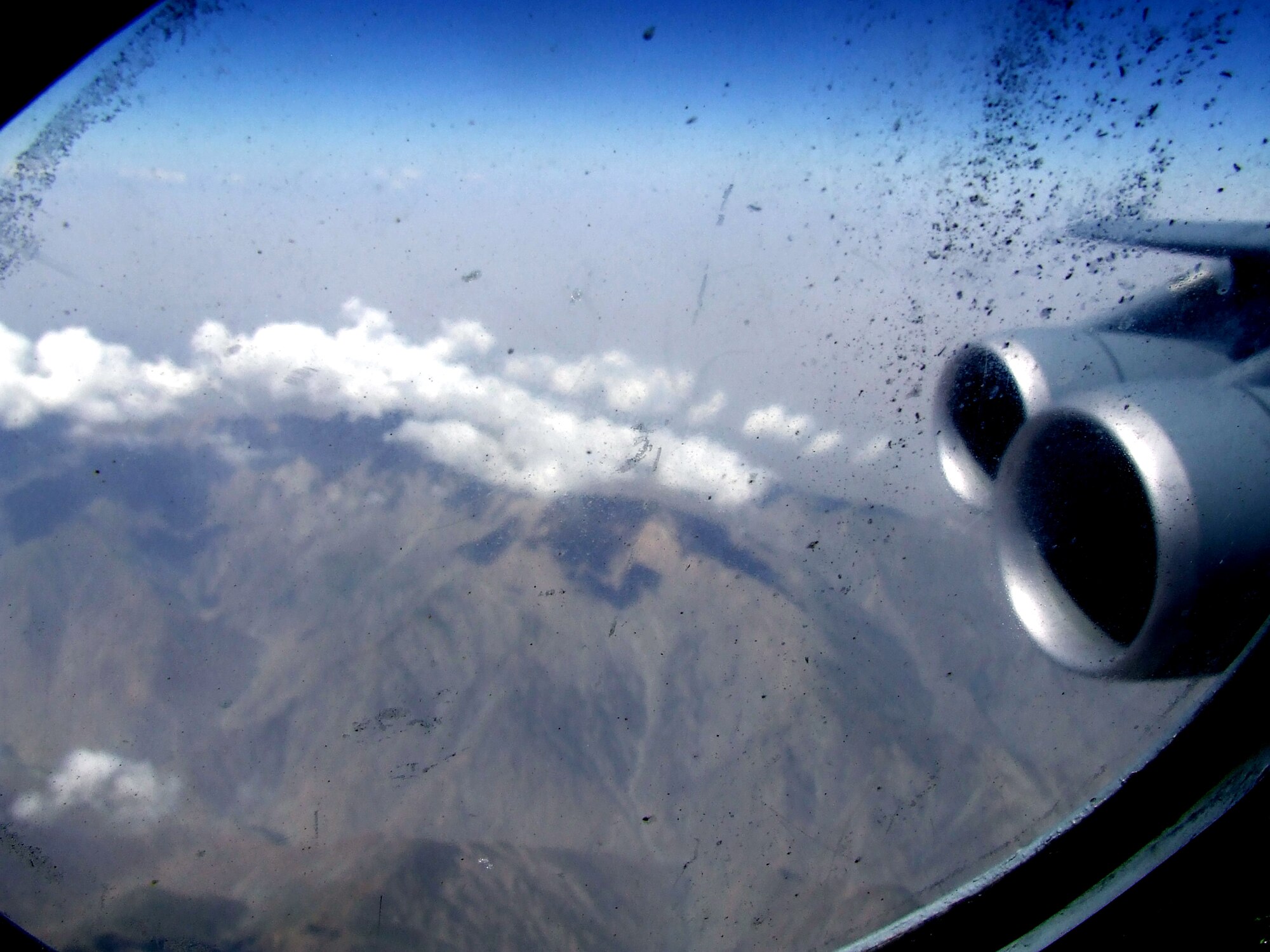The countryside of Afghanistan can be seen through the window of a C-5M Super Galaxy during an airlift mission on June 6, 2011.  The C-5M was on the first direct delivery airlift mission that went through the Arctic Circle from Dover Air Force Base, Del., to Bagram Airfield, Afghanistan, between June 5-6, 2011. (U.S. Air Force Photo/Master Sgt. Scott T. Sturkol)